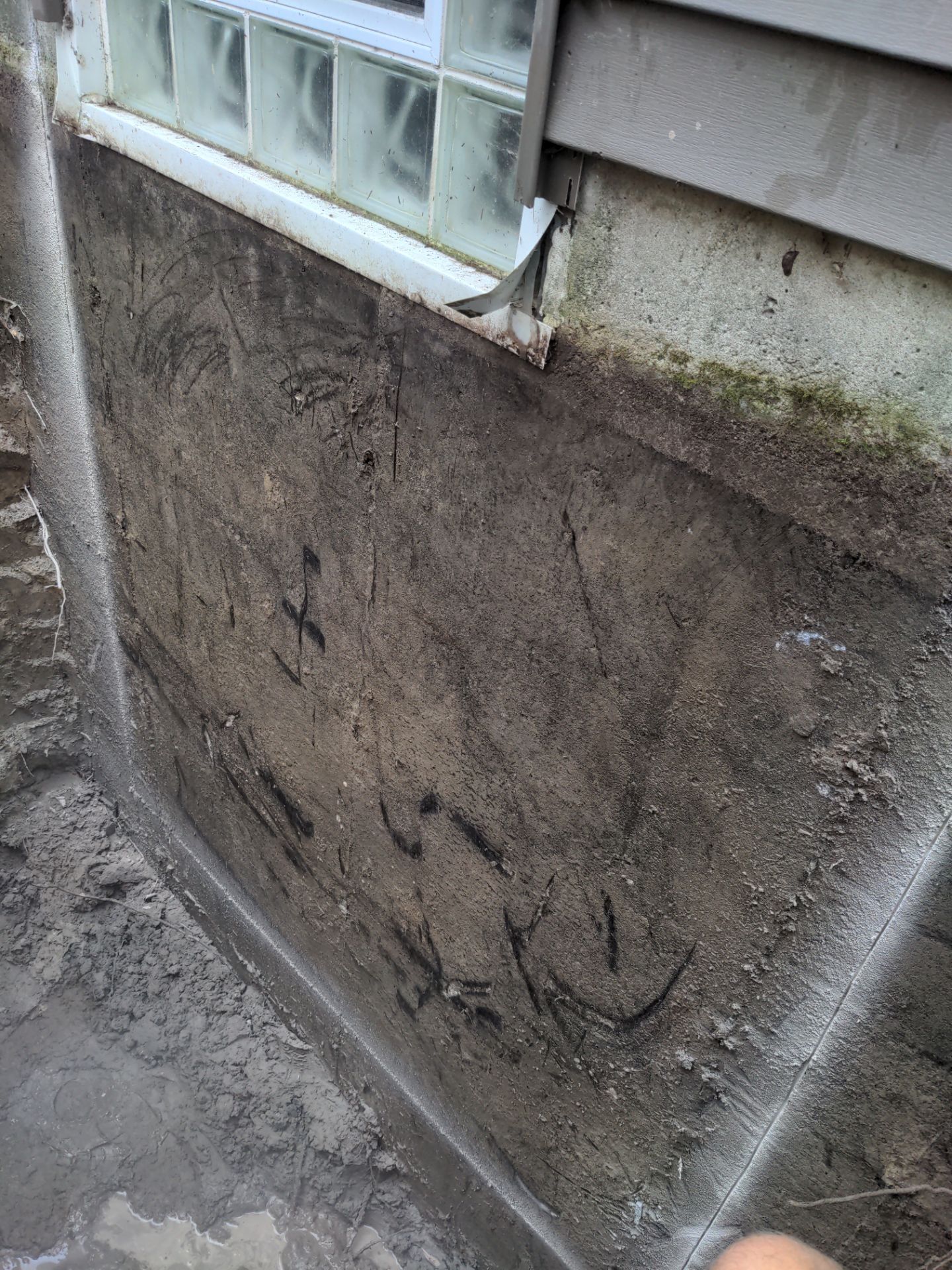 Interior Basement Waterproofing System and Egress Window Installation by Toledo Basement Repair 