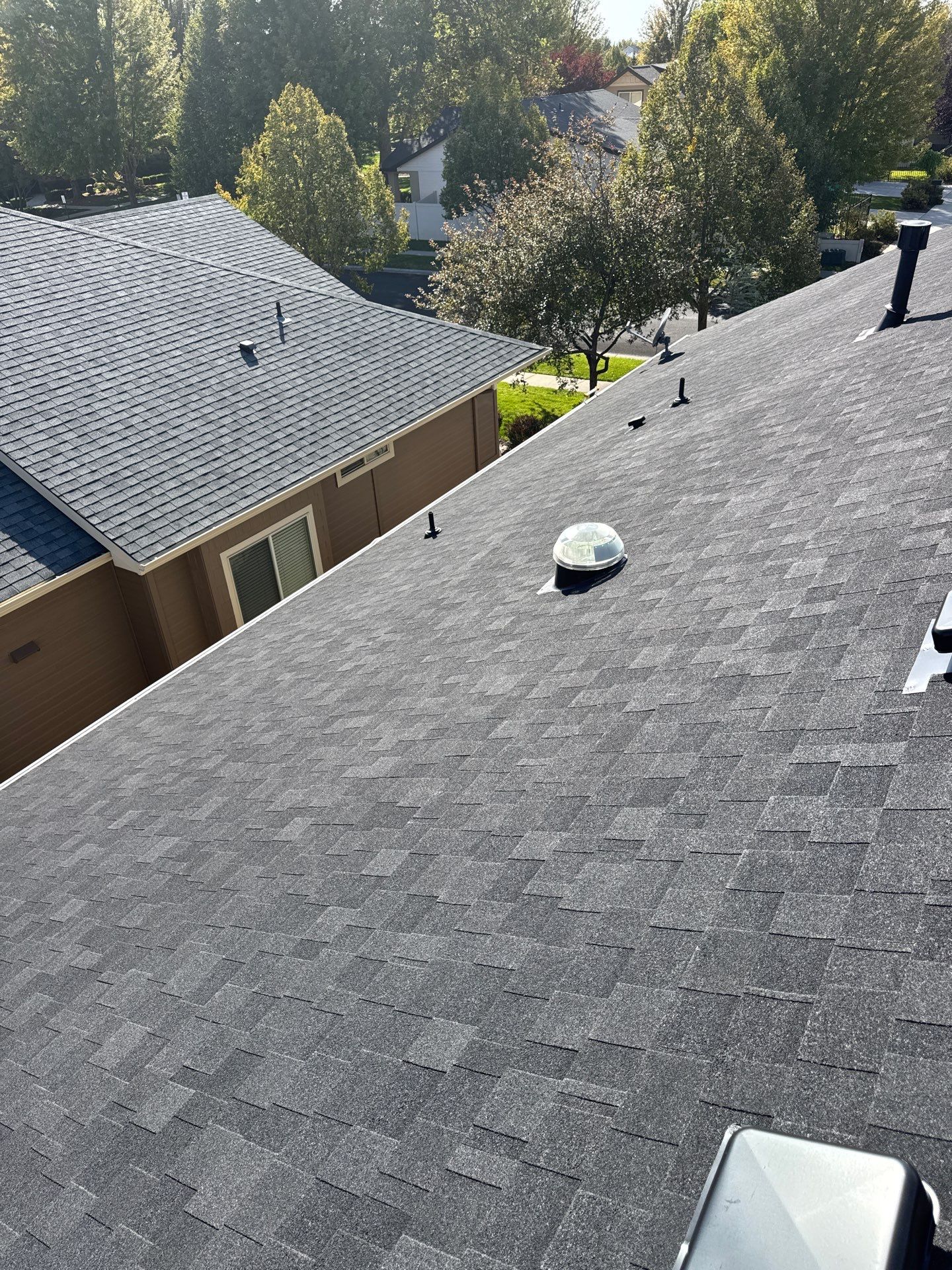 Residential Roof Replacement With Charcoal Architectural Shingles in Meridian by Olive Roofing