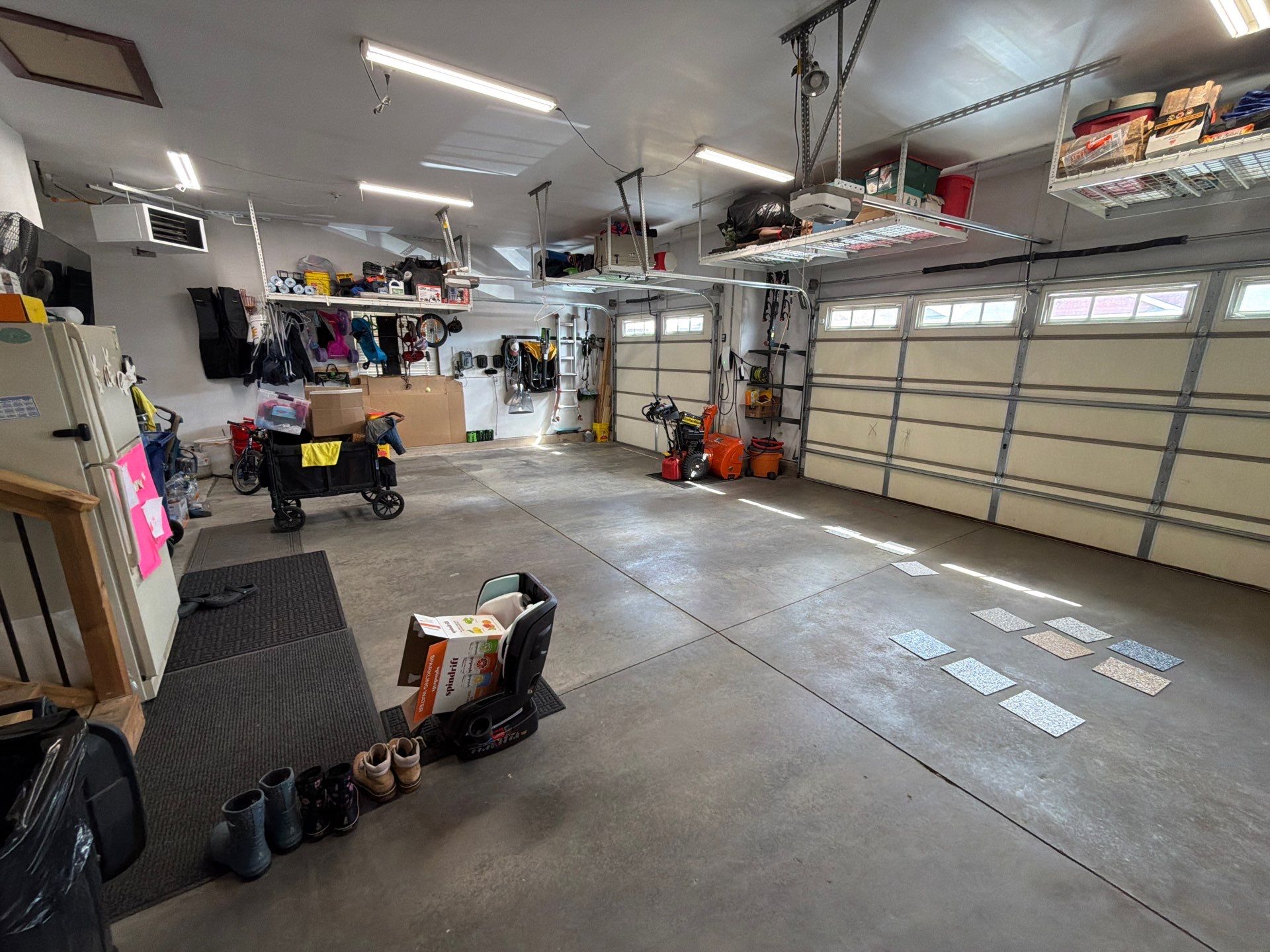 Feather Gray Epoxy Floor Coating Installation in Sioux Falls by Select Painting, Coatings & Garage Cabinets