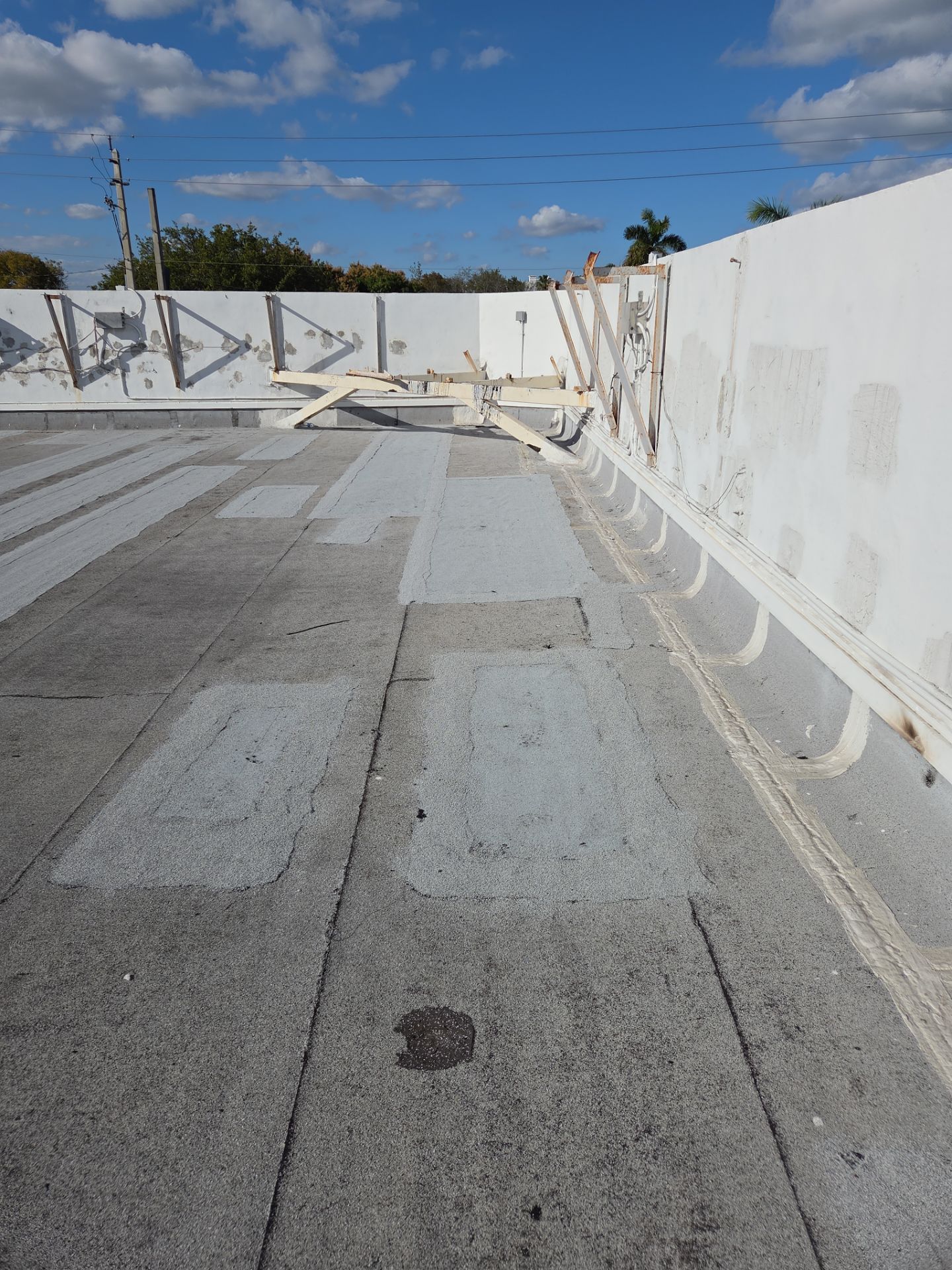 Commercial Flat Roof Restoration Using Silicone Coating in Hallandale Beach by Aastro Roofing