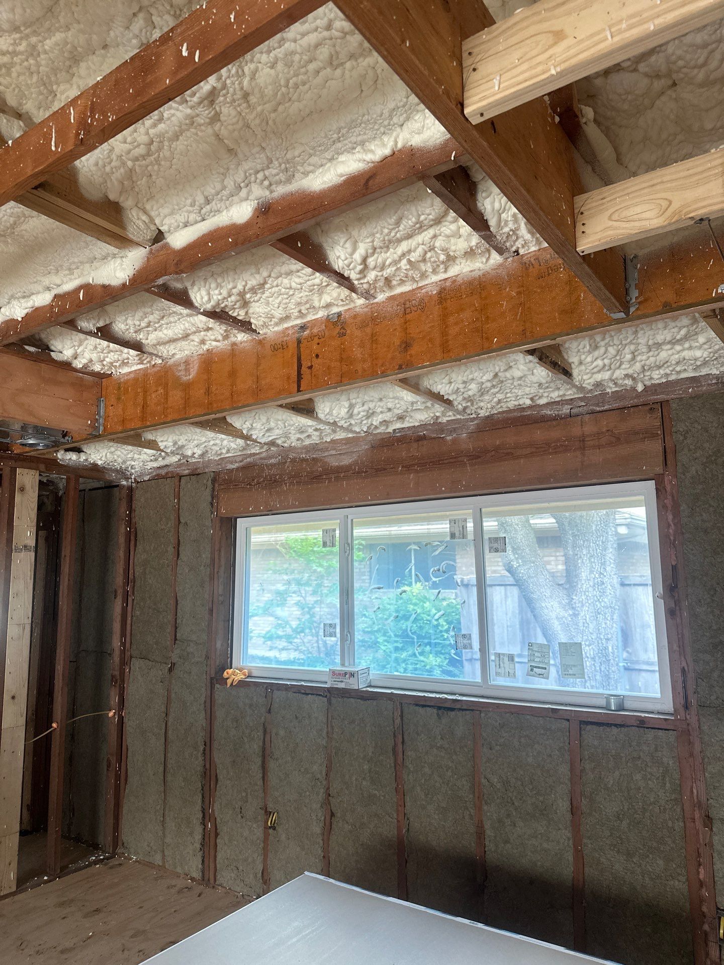 Open cell spray foam & rockwool job completed in Dallas TX by Apex Insulation Solutions