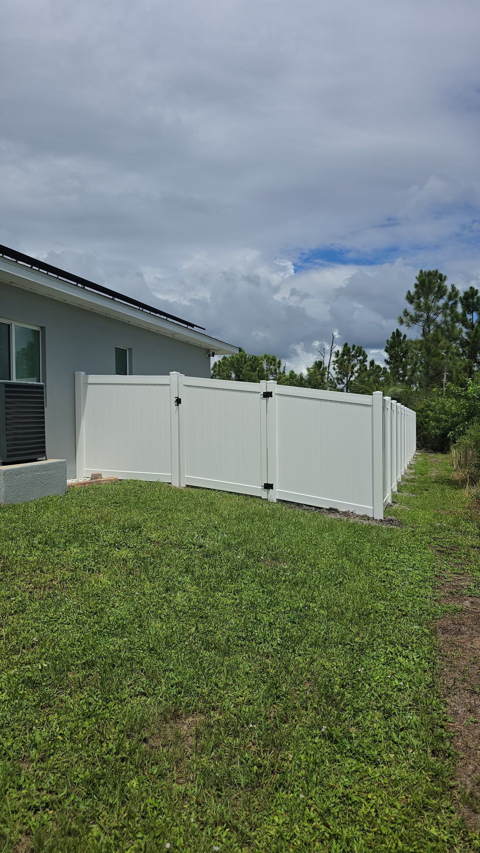 White Vinyl Privacy Fence Installation in Port Charlotte Florida by True Fence LLC