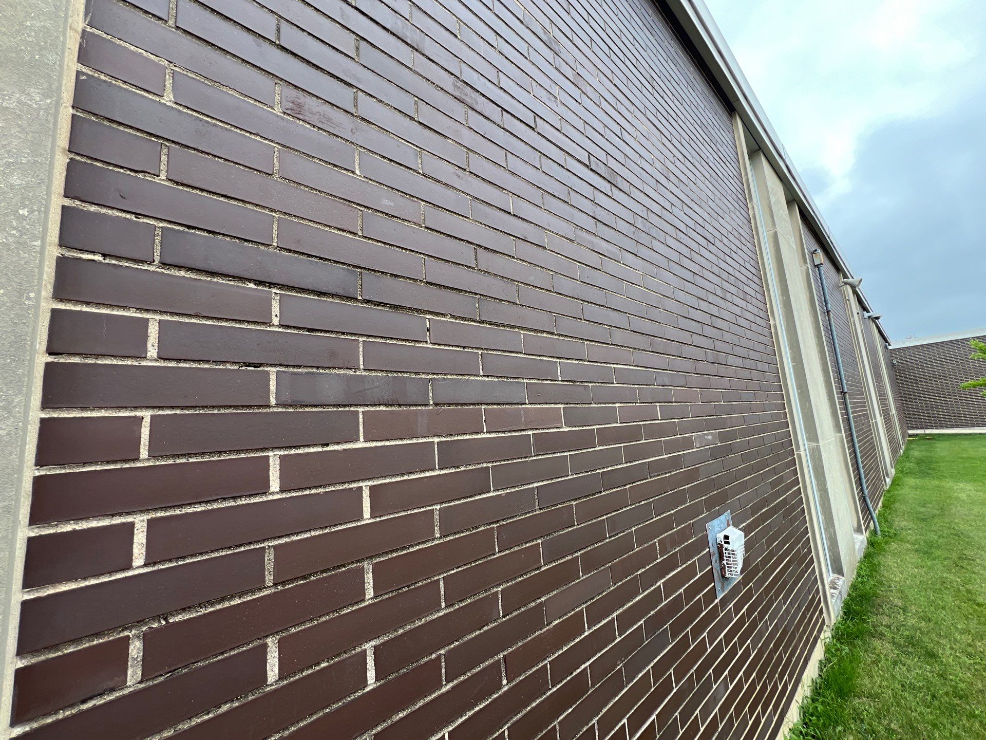 commercial pressure washing using Algaecide, soft wash soap by Northern Power Washing LLC.