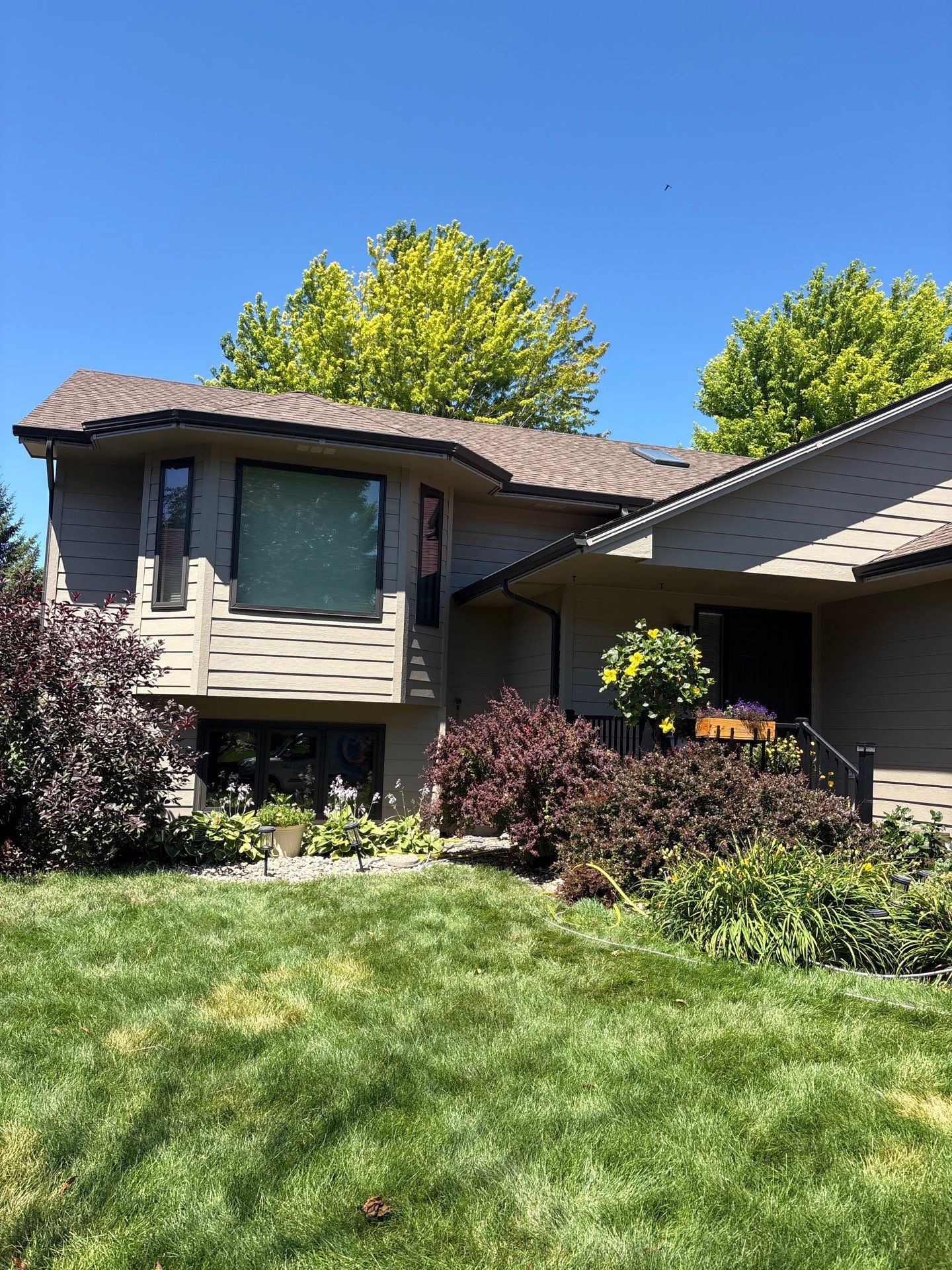Residential Exterior Painting and Trim Restoration in Sioux Falls by Select Painting, Coatings & Garage Cabinets