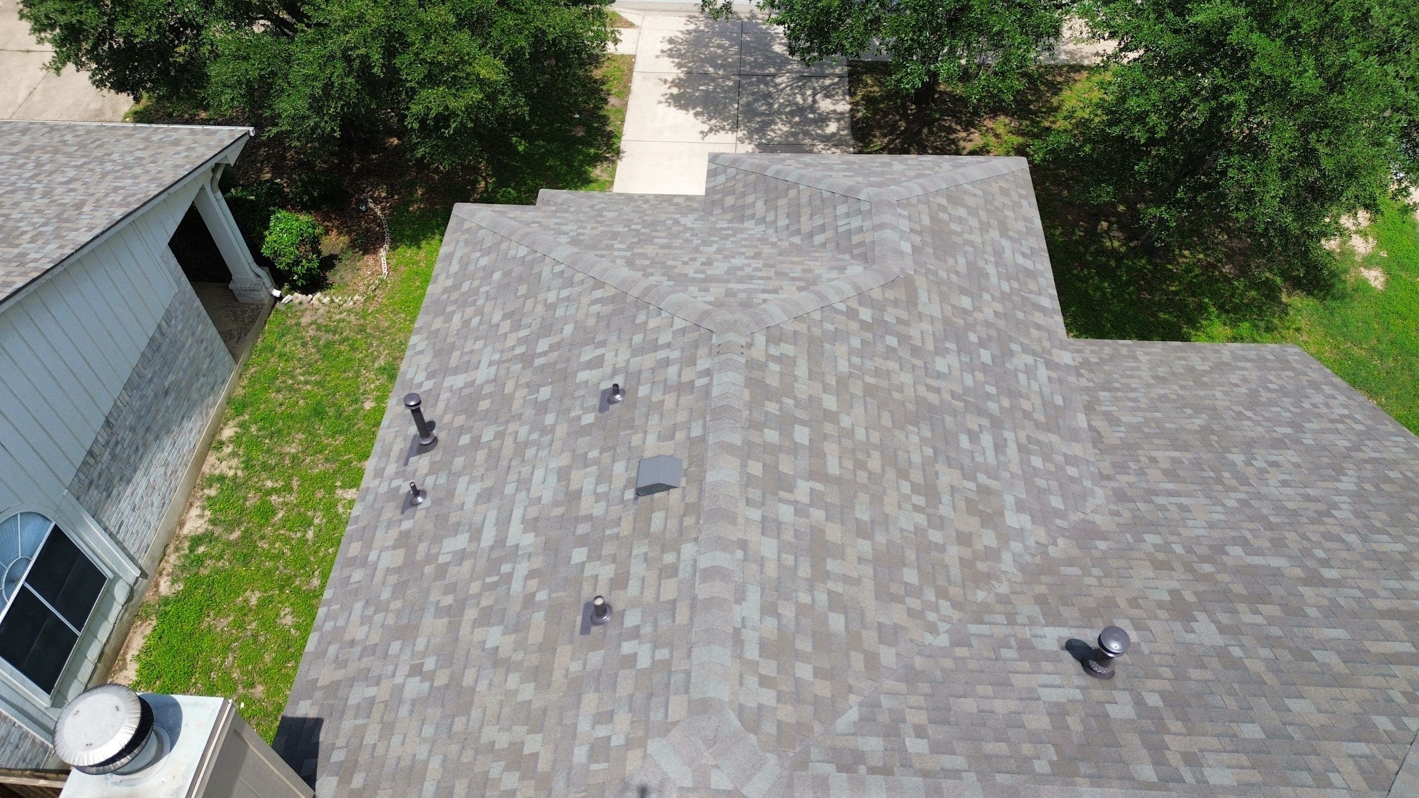 Roof Replacement & Chimney Cricket Upgrade in Cedar Park, TX by Kstylez Roofing & Construction