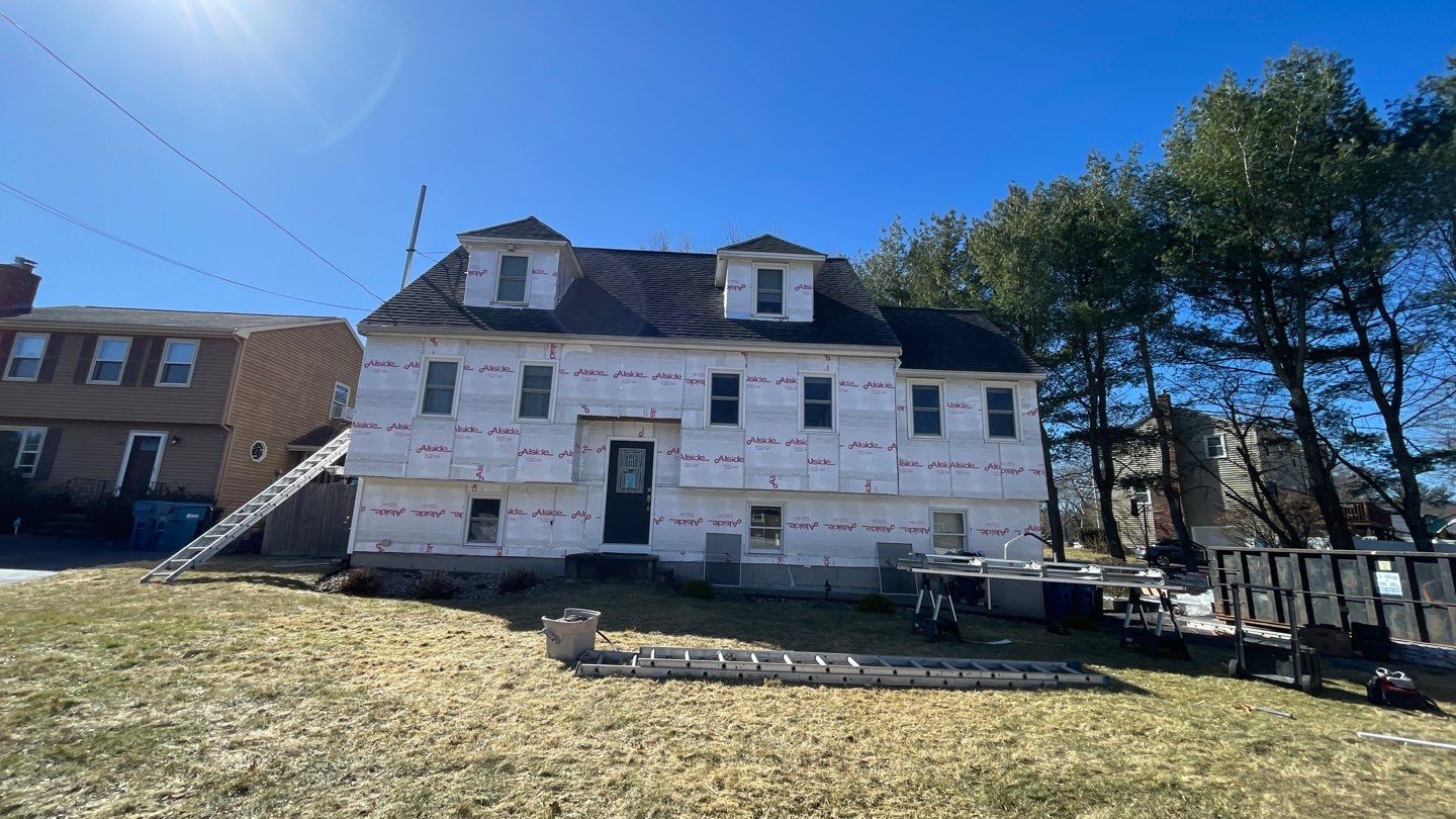 Complete Exterior Renovation with New Siding & Gutters   by Sensible Home Solutions