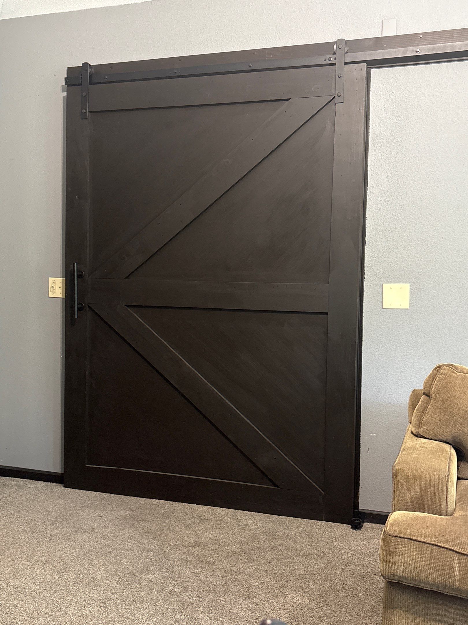 Dark-Stained Wood Sliding Barn Door Installation in Waukesha by CompanyCam Sales Demo