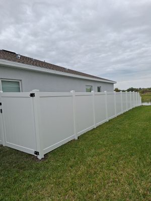 Vinyl Fence Installation using Vinyl Fence and Black 3 Rail Aluminum Fence 