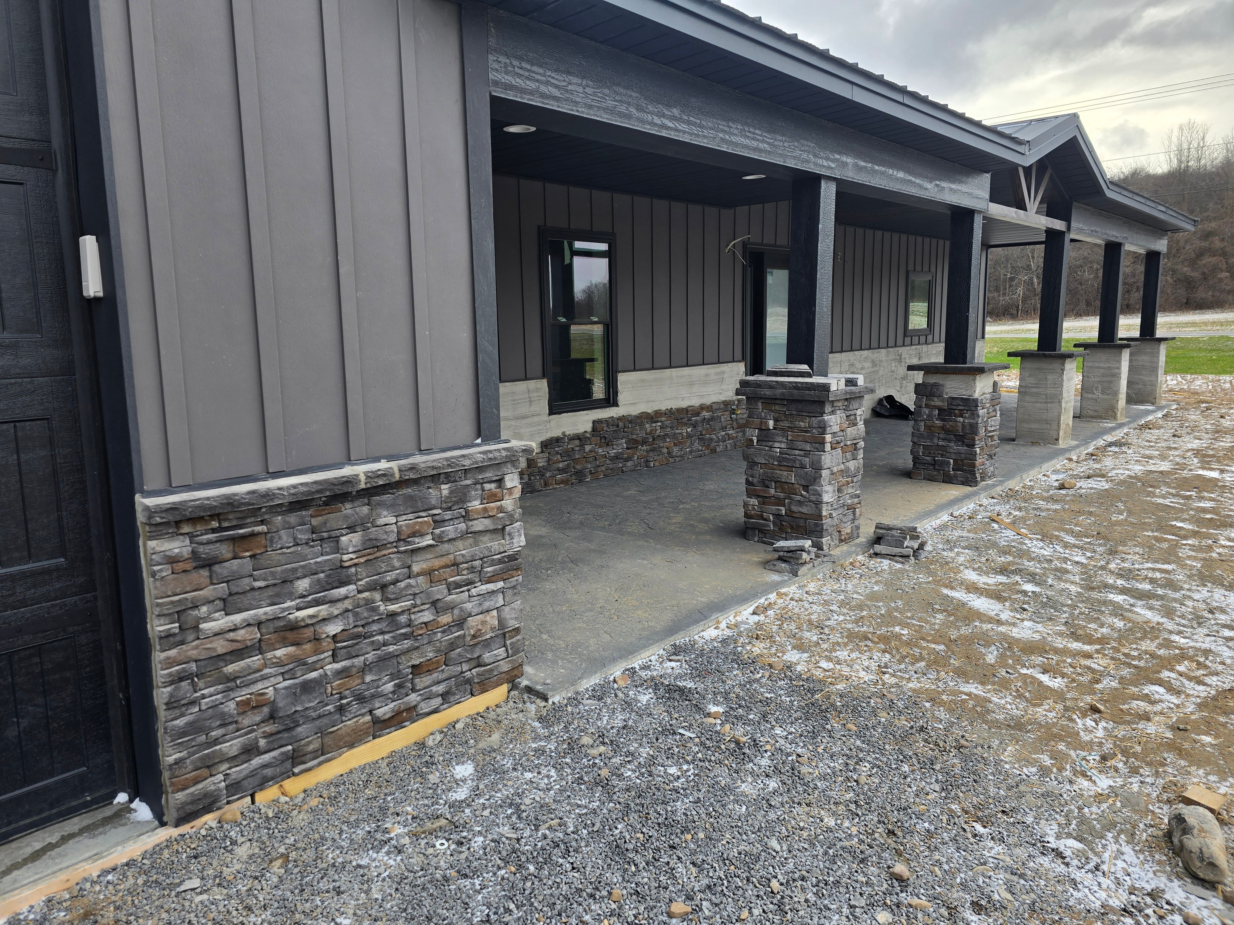 Barndominium  using Textured Board & Batton by Horst Custom Homes 