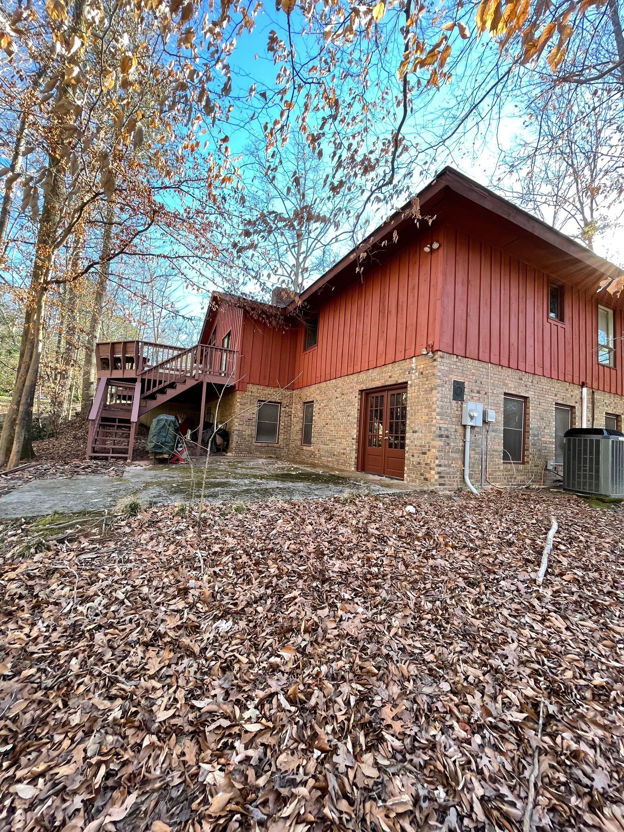 Exterior Wood Siding Painting and Gutter Refurbishment in Roswell by Swift Home Renovations