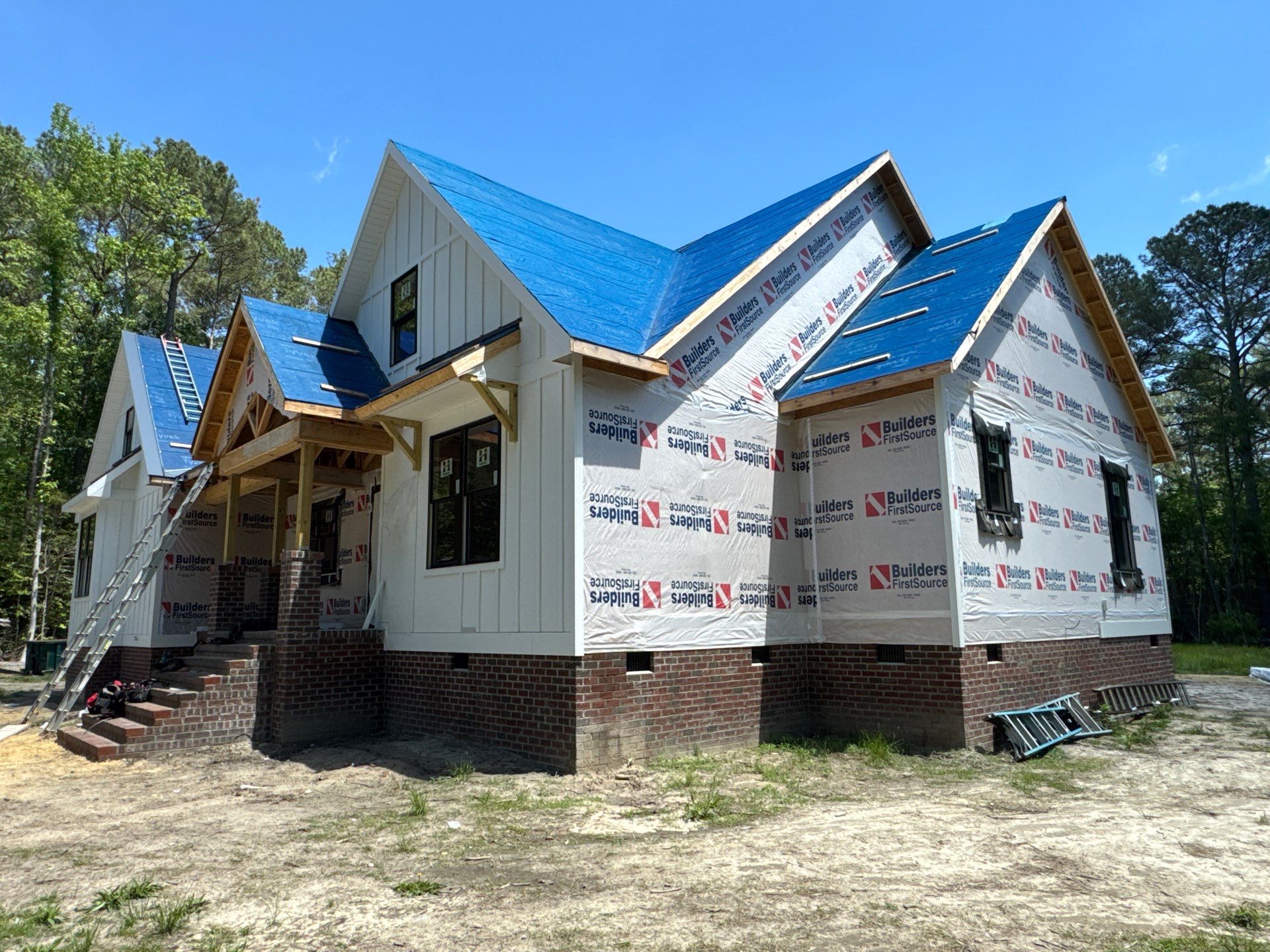 Custom New Construction Home Featuring Standing Seam Metal Roofing in Port Haywood by Cade Construction