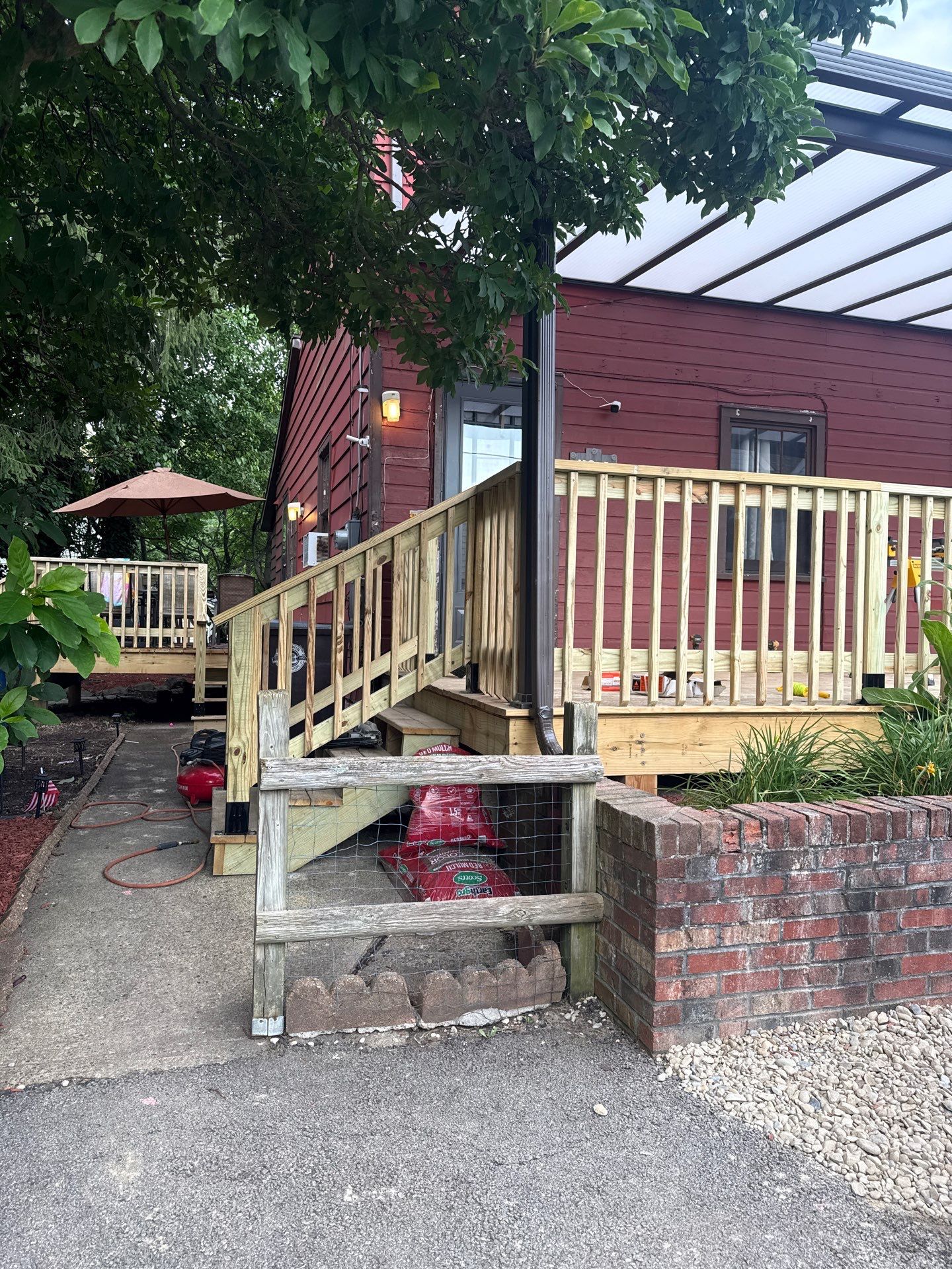 Roof sunspace deck  by Cousins Roofing Siding & Decks