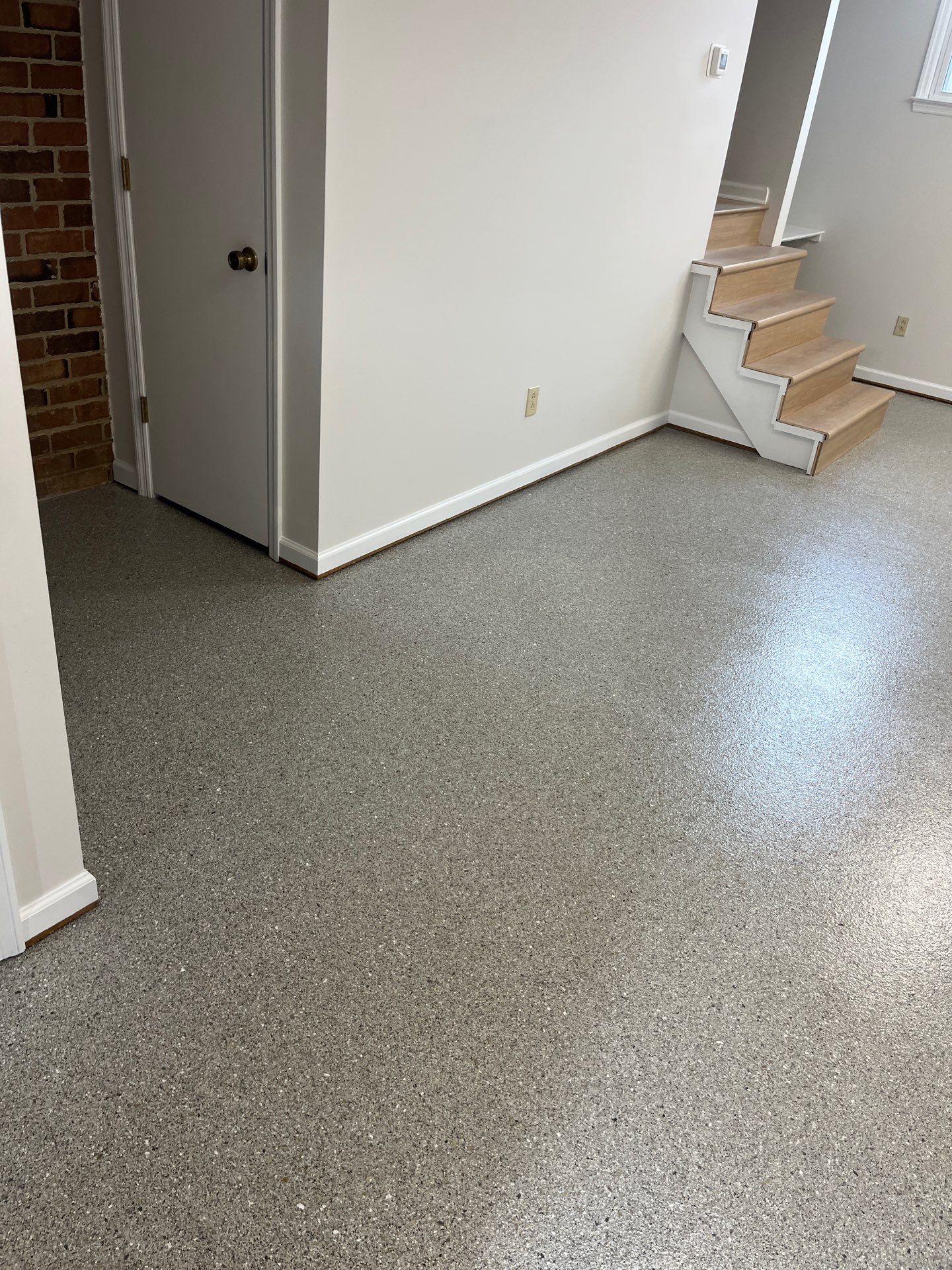 Basement Floor Coating using Quartzite by My Garage Floor Guys