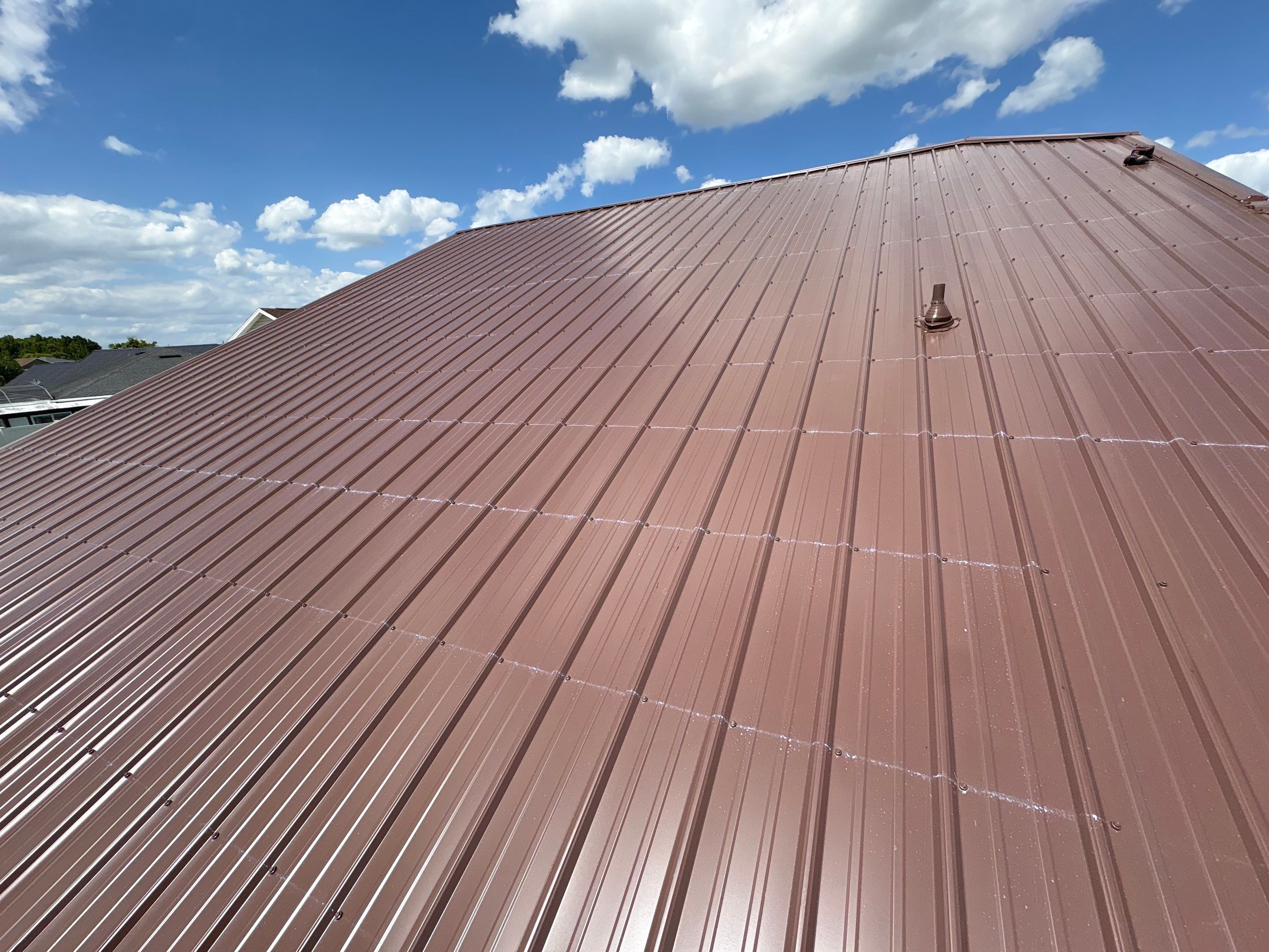 Residential Metal Roofing Installation and Gutter Replacement in Kissimmee by Pinnacle Roofing Group