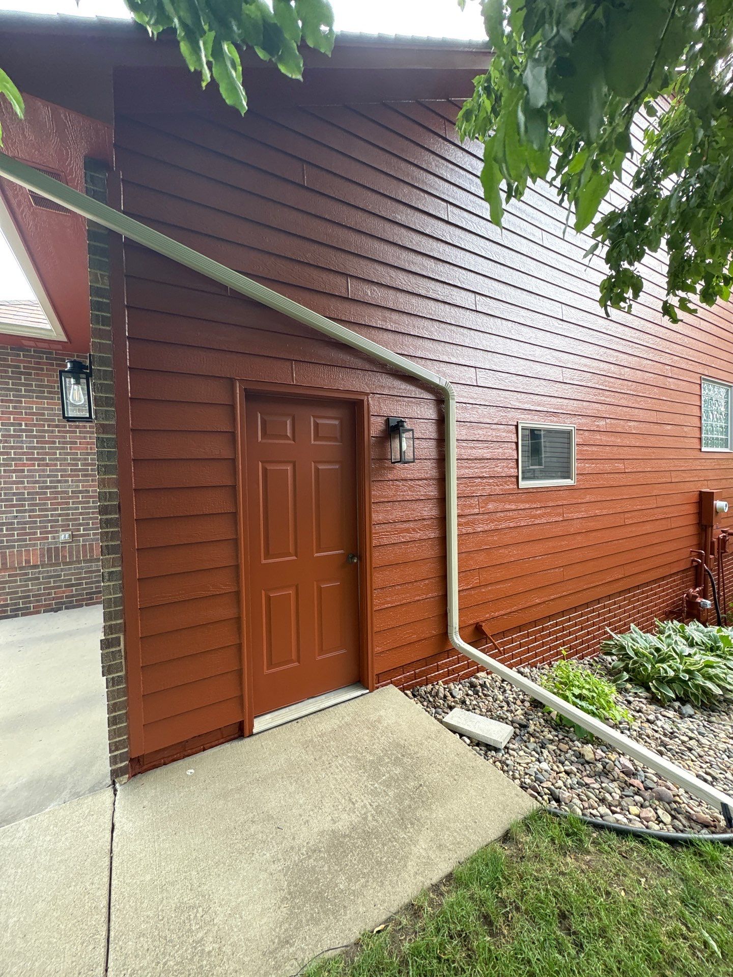 Full Exterior Home Repaint and Siding Refresh in Sioux Falls by Select Painting, Coatings & Garage Cabinets