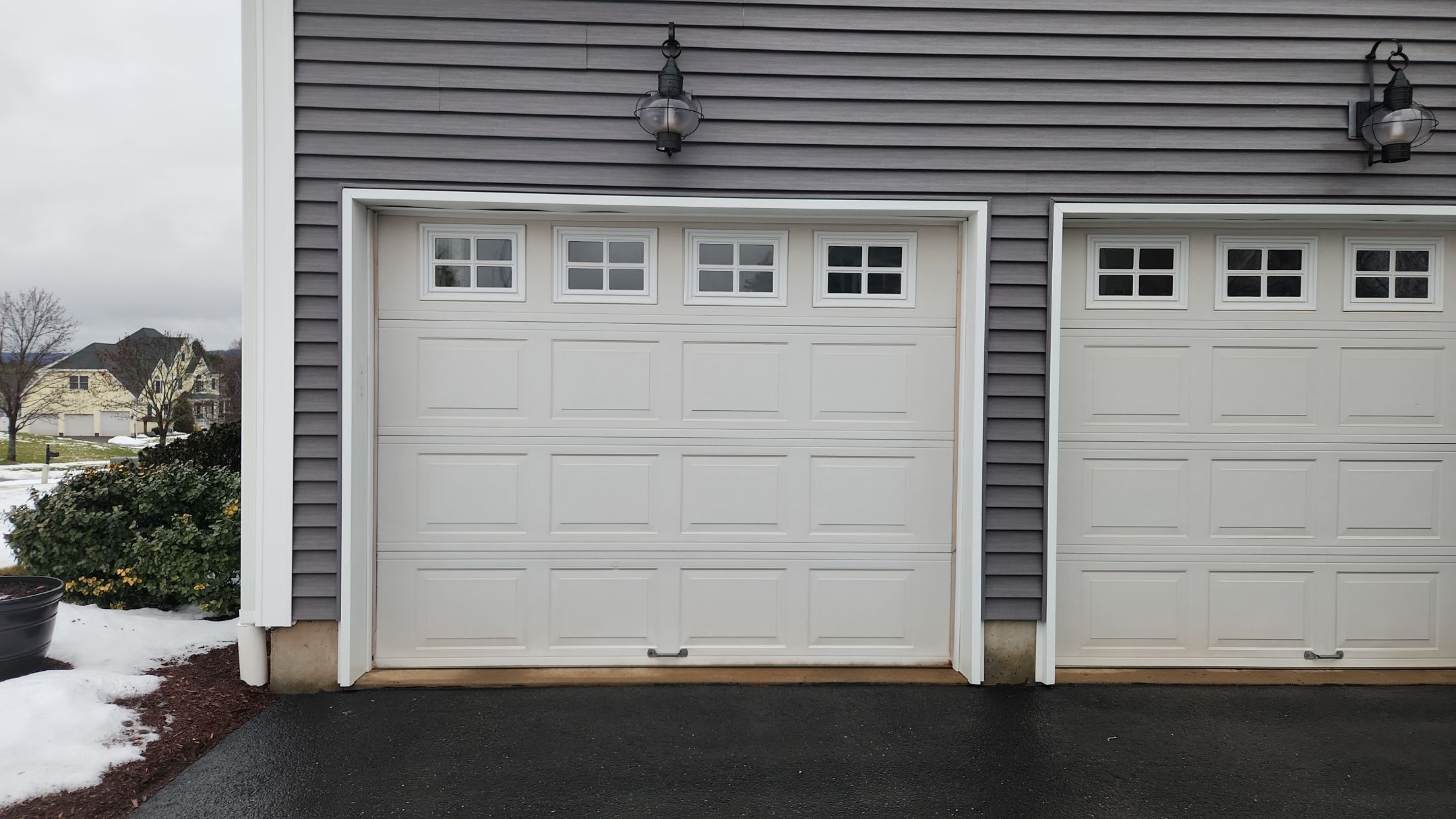 Garage Door Upgrade with Classic Style & Window Accents by DiGiorgi Roofing and Siding Inc