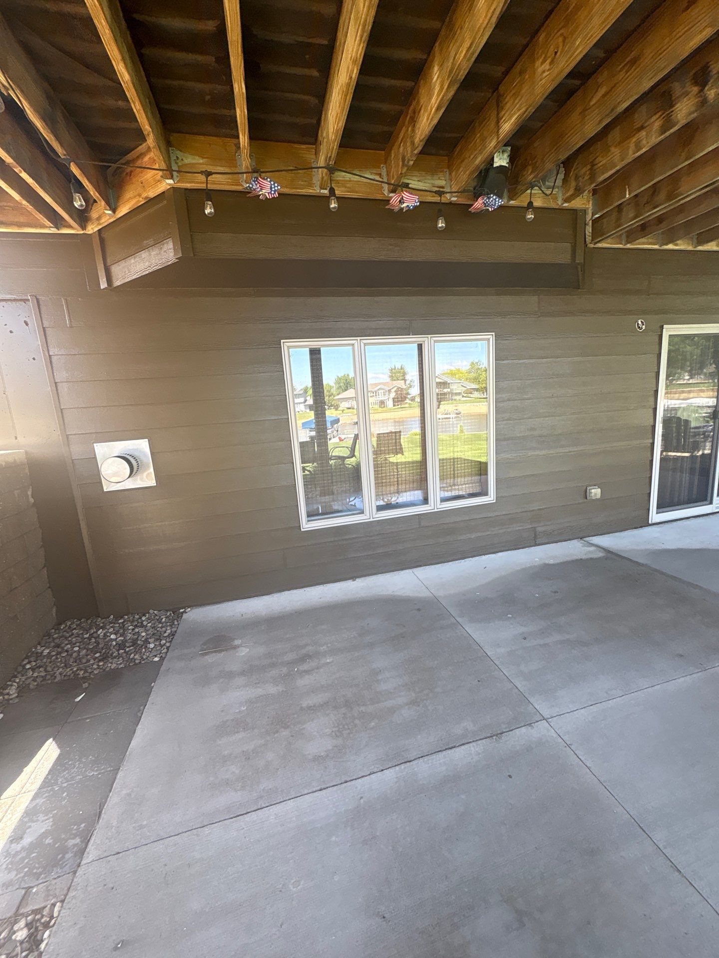 Full Exterior Renovation with Stone Veneer and Composite Decking by Select Painting, Coatings & Garage Cabinets