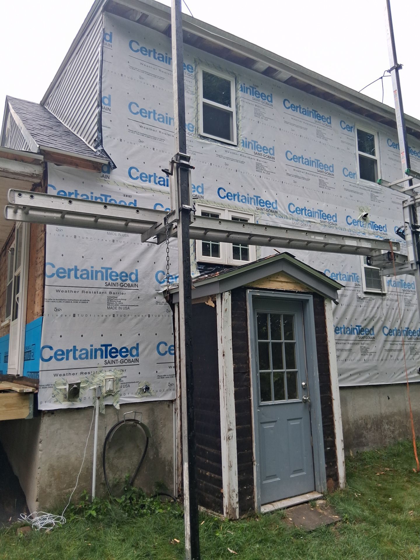Complete Exterior Renovation Featuring Owens Corning Shingles and Vinyl Siding by Tall pine roofing