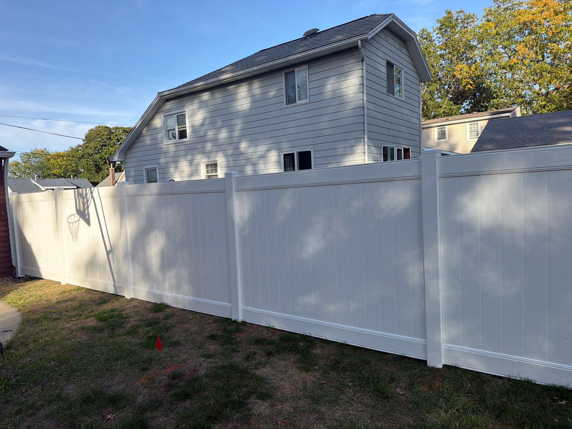 White Vinyl Privacy Fence and Gate Installation in Grundy Center by Perfect Picket Fence and Stain