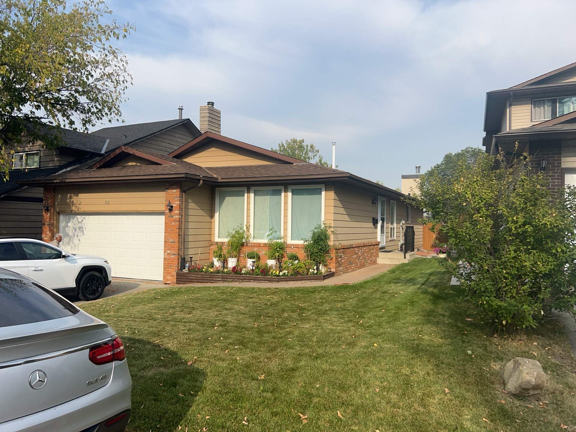 Calgary Chimney Chase Reconstruction and Exterior Siding Replacement by Smart Home Building Systems Ltd.