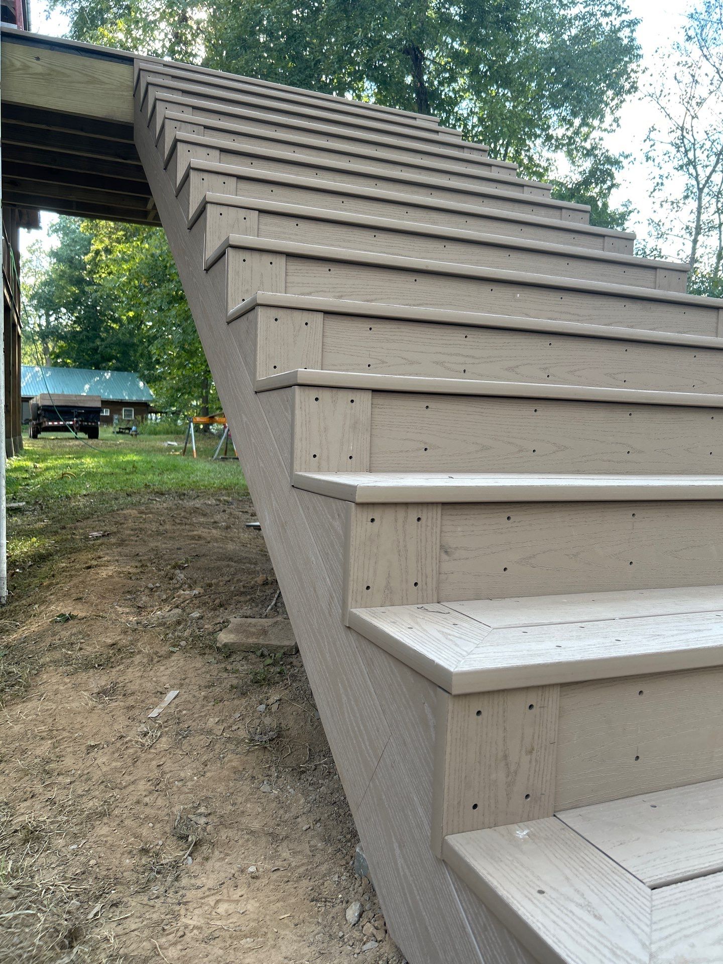 Log Cabin Wrap-Around Deck and External Staircase Installation in Caldwell by Walnut Hollow Decks & Outdoor Living