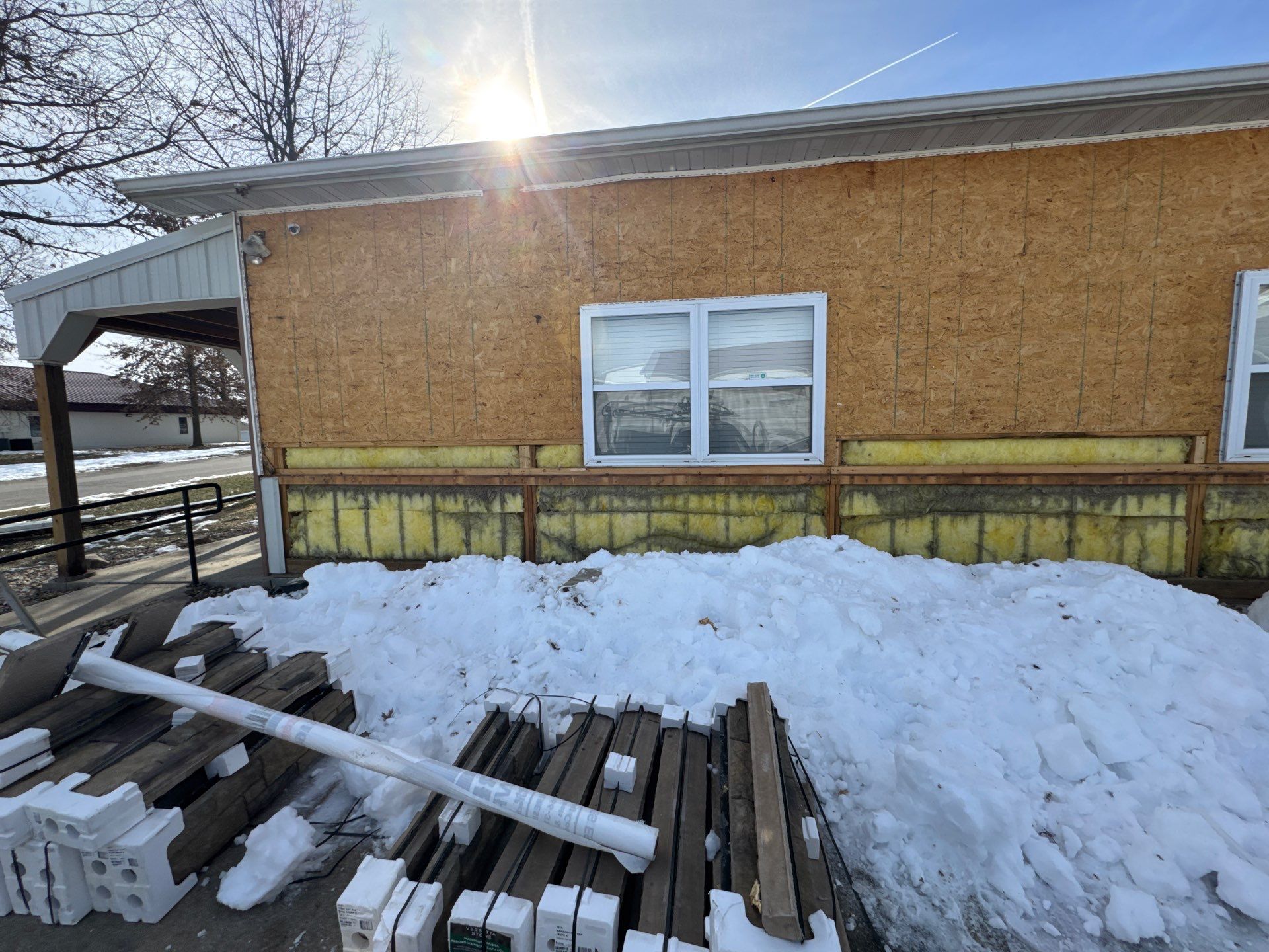 Siding and Stone Installation using Extrerior Porfolio Vinyl Siding and Versetta Stone by EEC  Windows, Siding & Roofing 