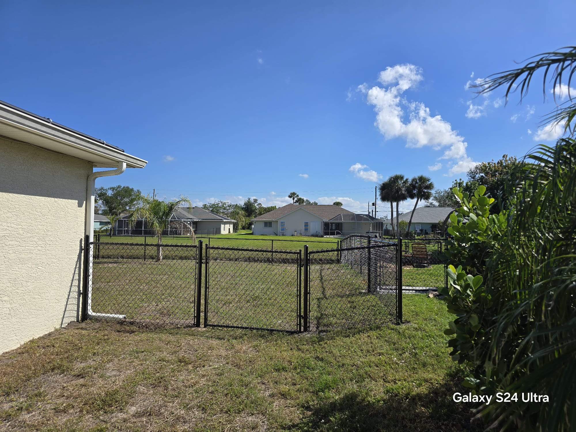 Waterfront Black Chain Link Fence Installation in Rotonda West by True Fence LLC