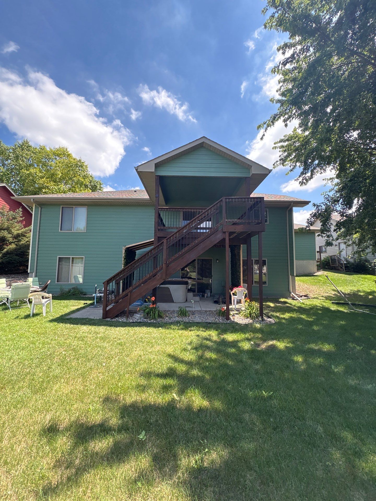 Full Exterior Residential Painting and Siding Refresh in Tea by Select Painting, Coatings & Garage Cabinets