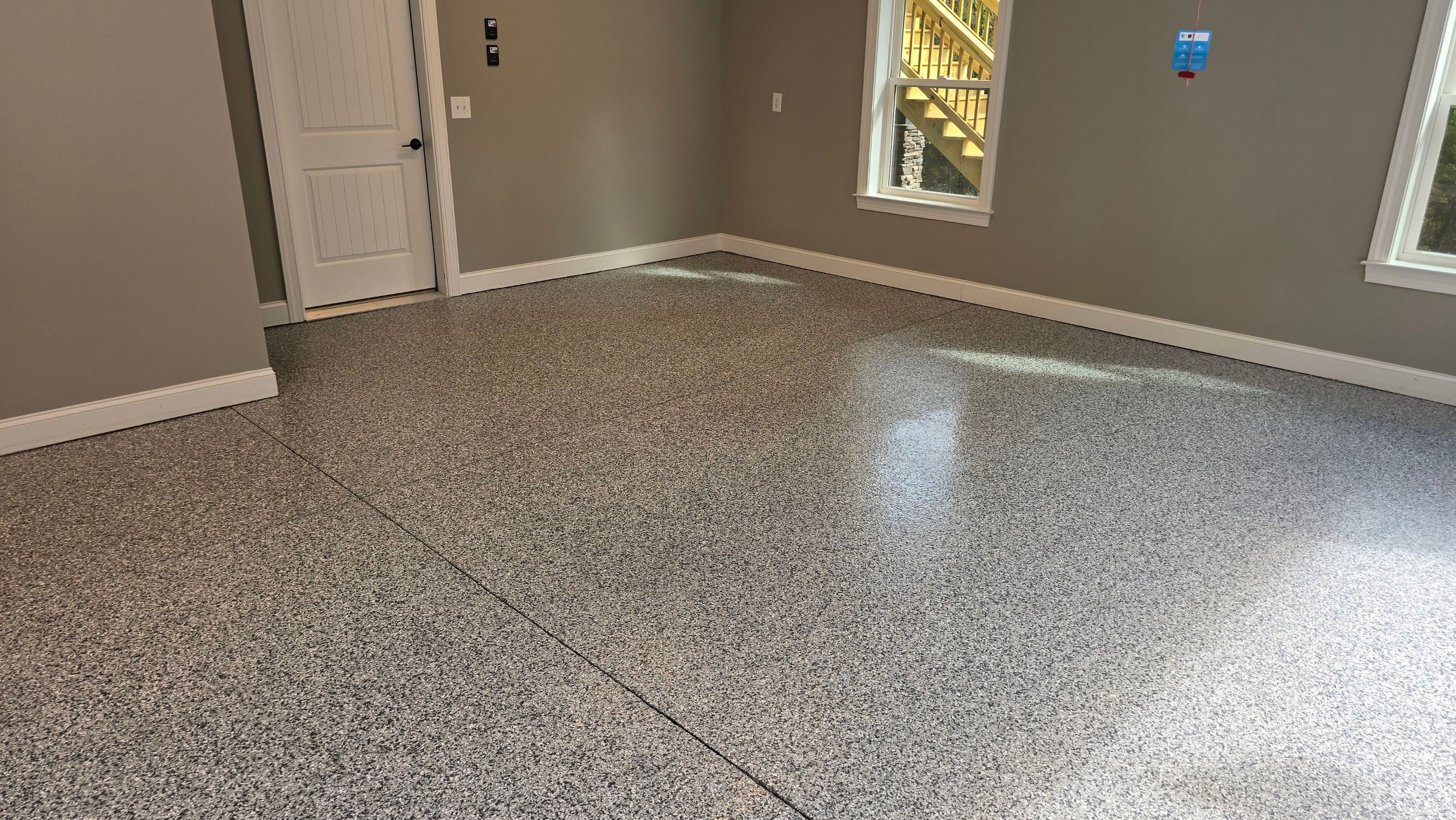 Patio Using Basalt & Garage Using Gravel by Elite Floor Solutions
