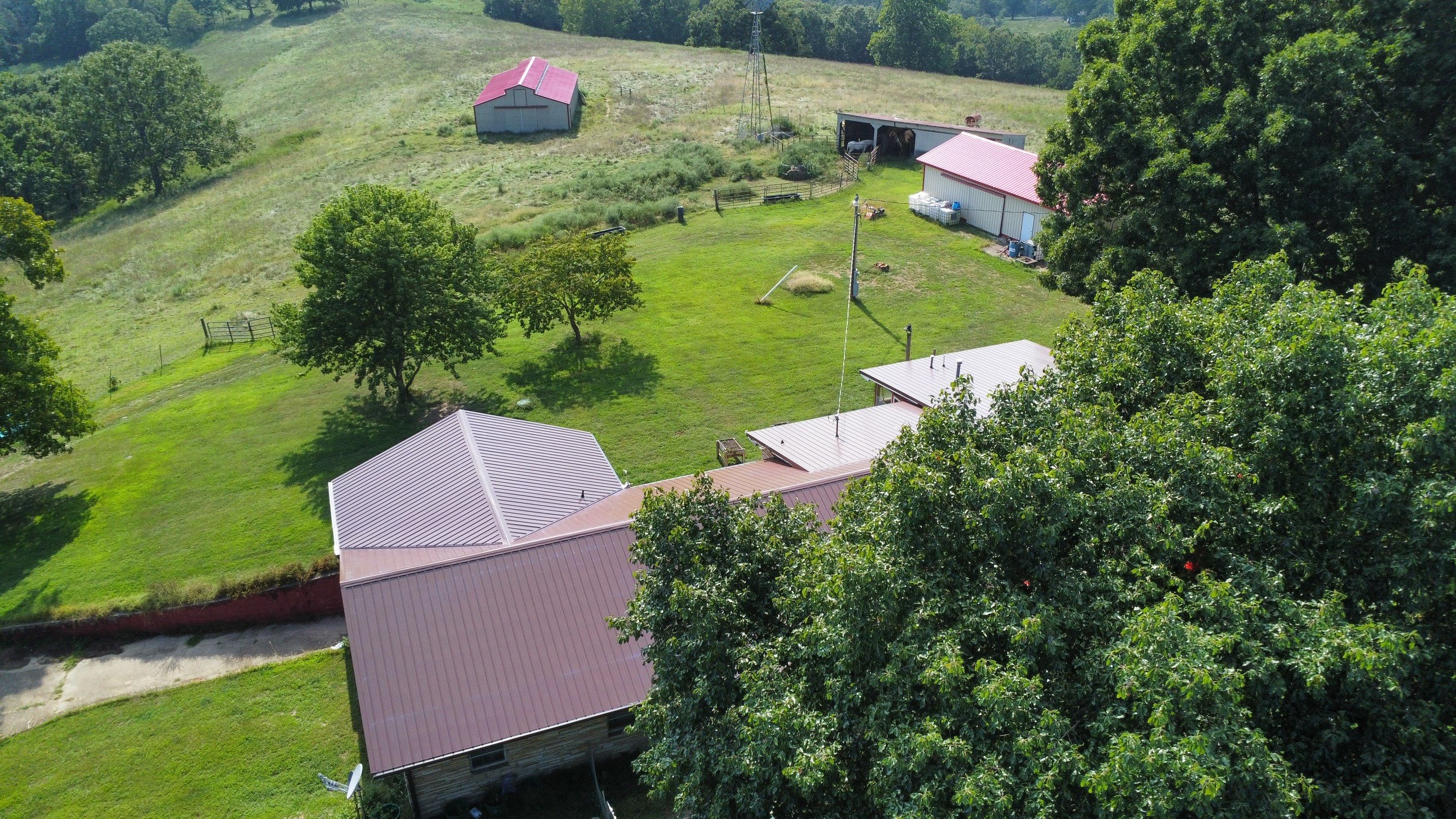 Residential Roofing Install - 29 Gauge G-Rib Metal - Color Brown & Crimson Red by Titan Commercial & Residential Roofing 