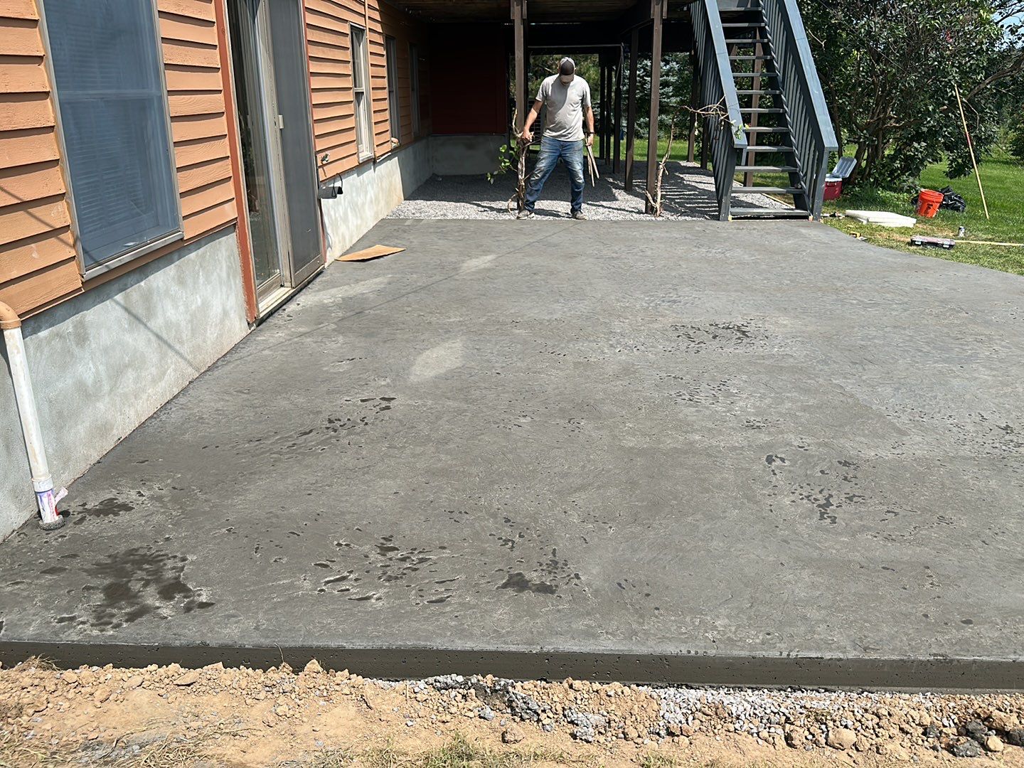 Bluestone textured concrete stamped patio  by NG Masonry & Construction LLC