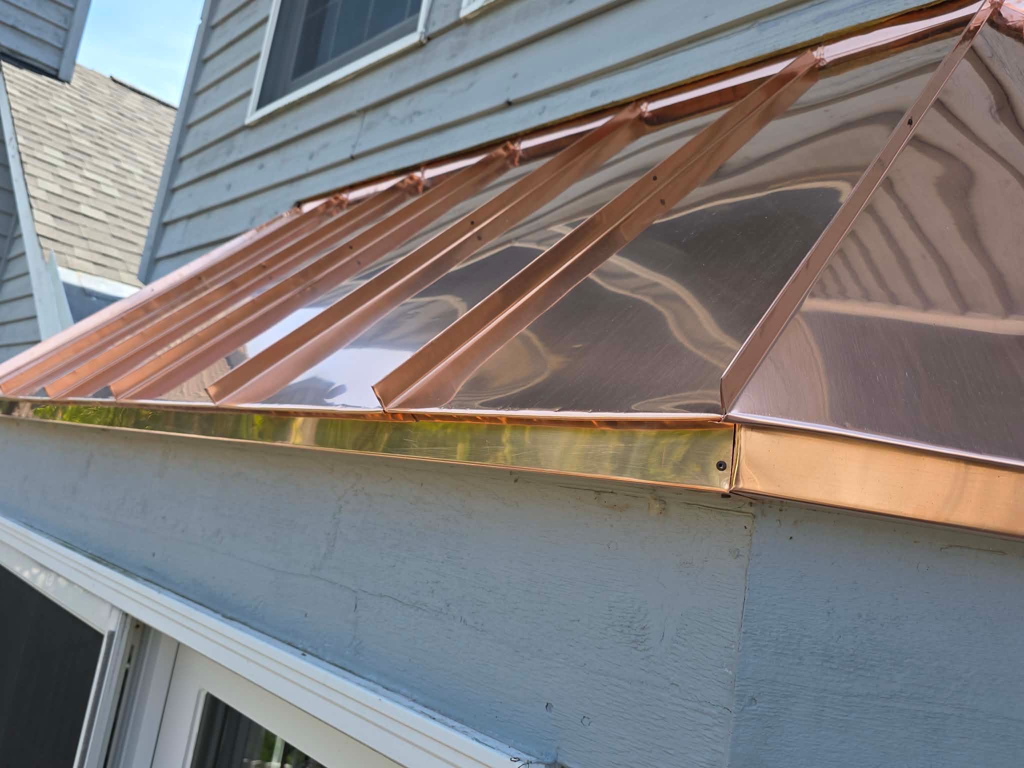 Roofing, copper chimney cap and copper awning by Optimal Home Improvement 