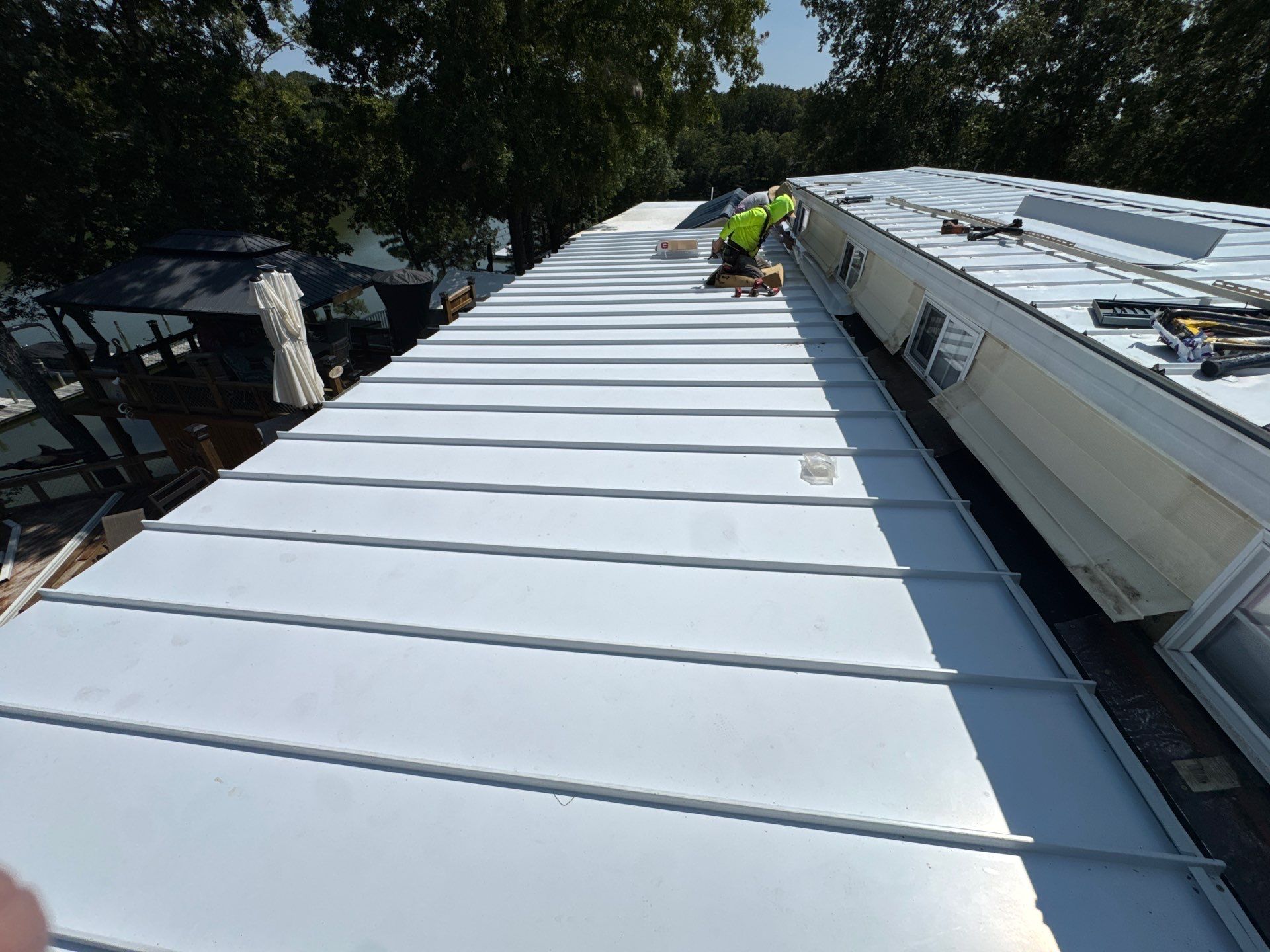 White Standing Seam Metal Roof Installation in Wake, VA by Cade Construction