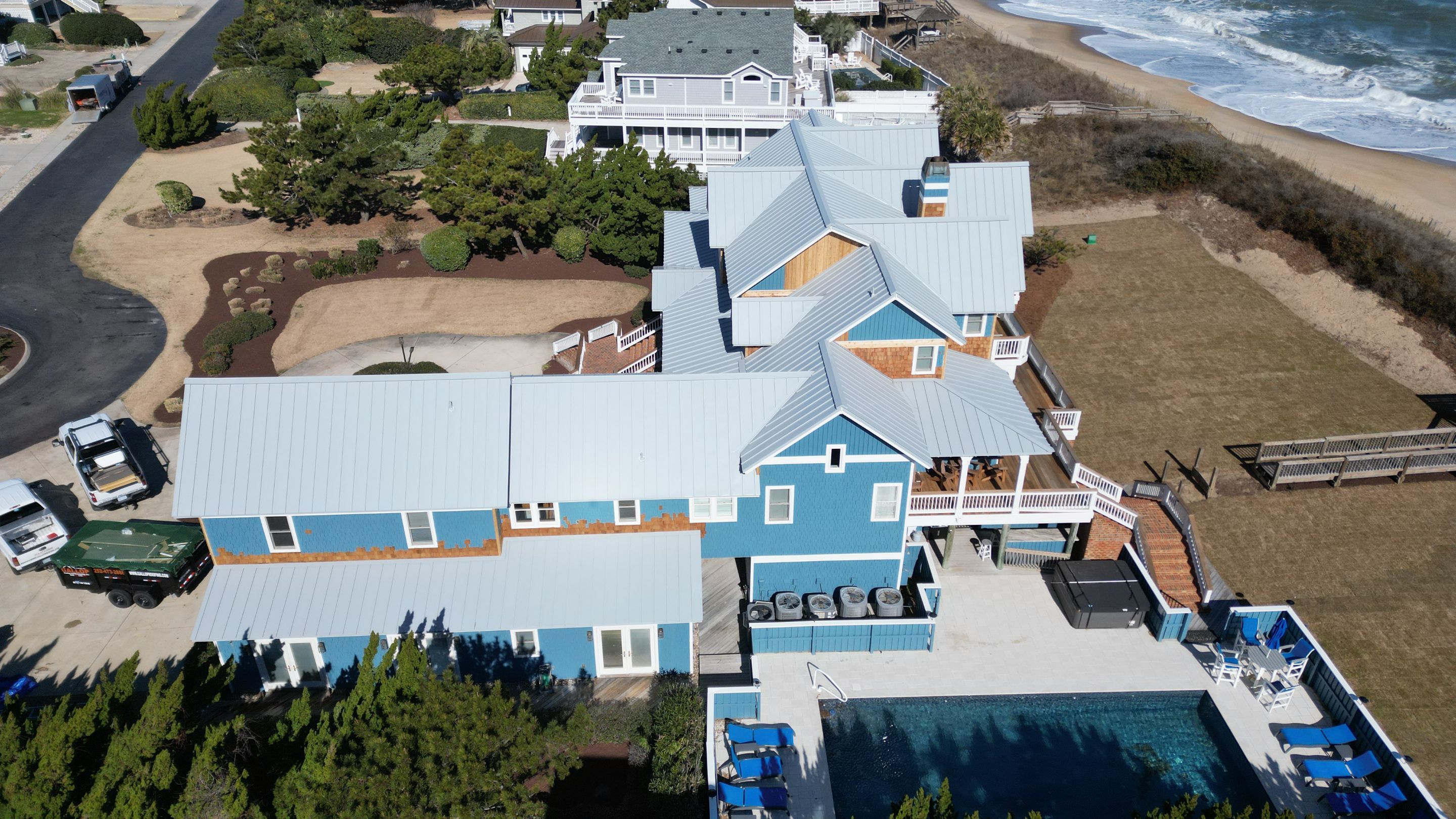 Large Metal Roof Transformation by Gallop Roofing & Remodeling, Inc.