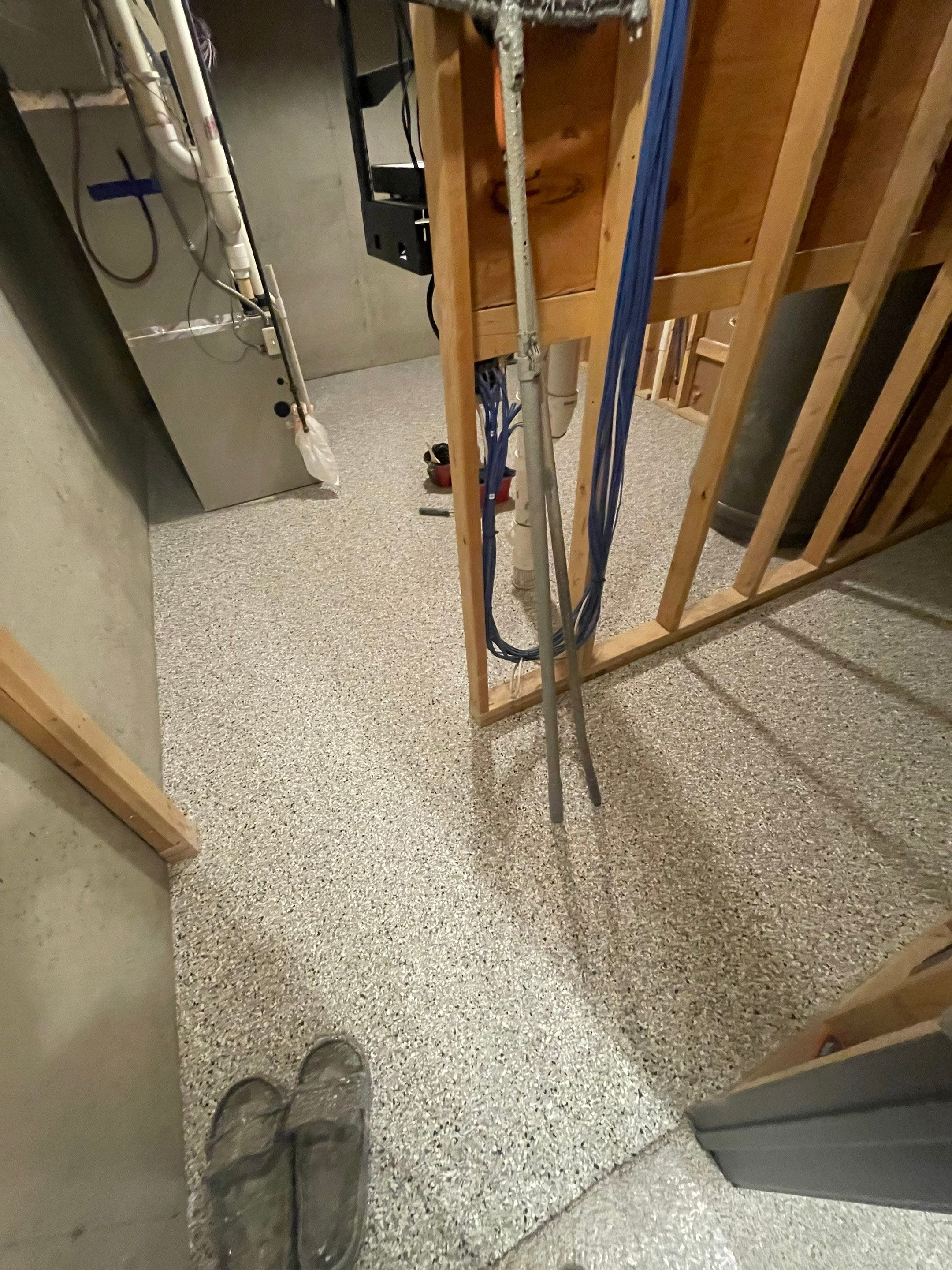 Sioux Falls Basement Floor Transformation with Durable Epoxy Flake Coating by Select Painting, Coatings & Garage Cabinets
