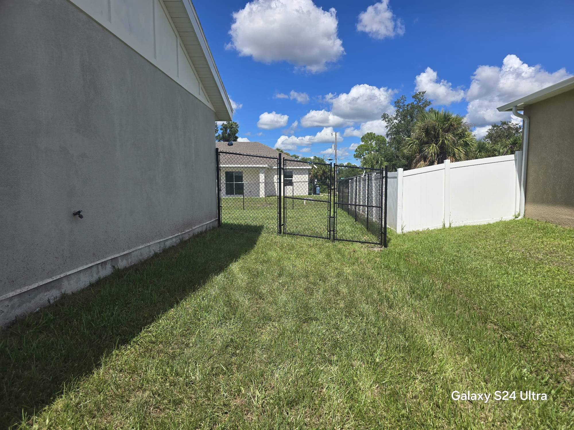 Residential Black Chain Link Fence Installation in North Port by True Fence LLC