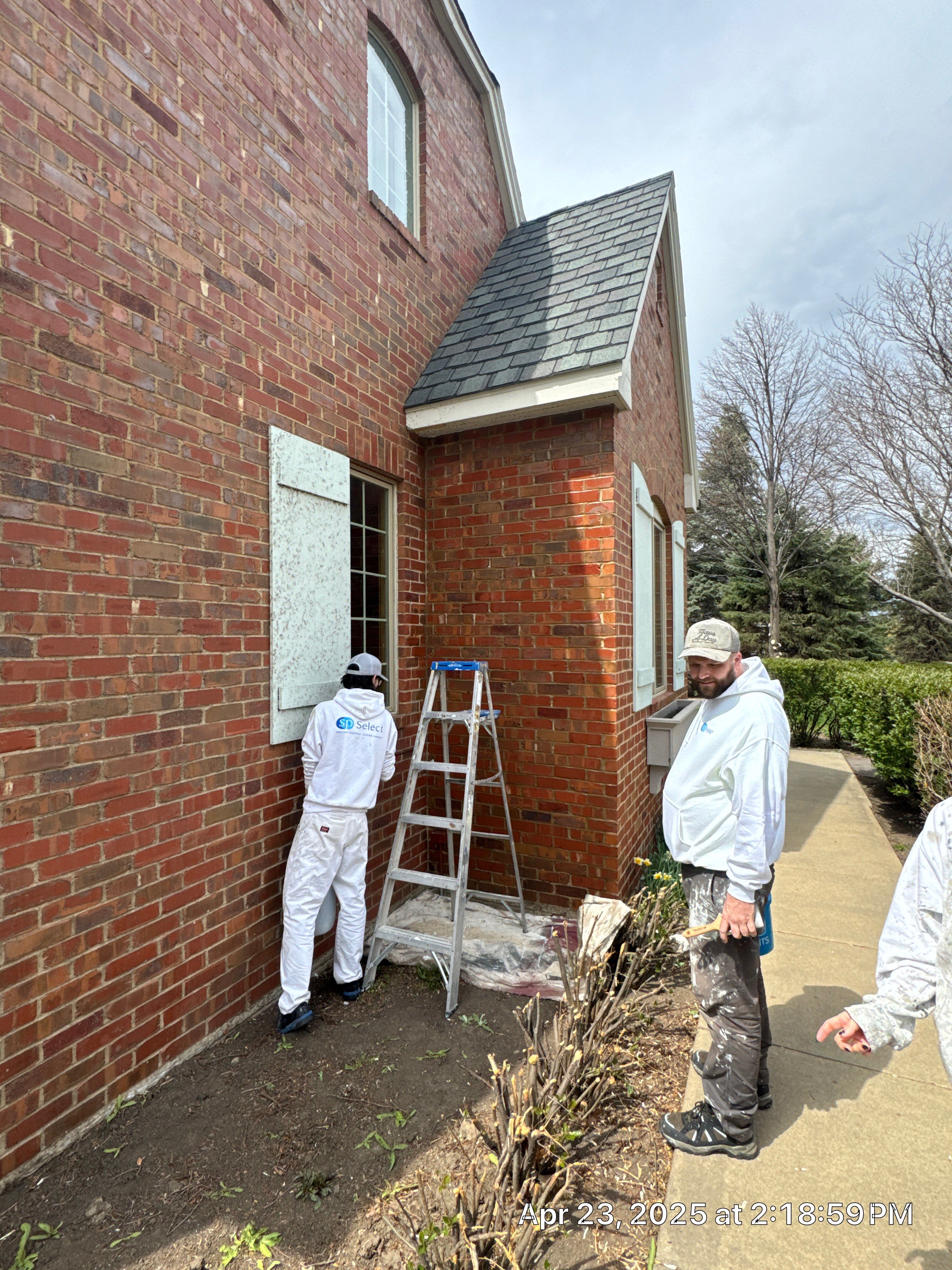 Residential Exterior Brick Painting and Limewash Refresh in Sioux Falls by Select Painting, Coatings & Garage Cabinets