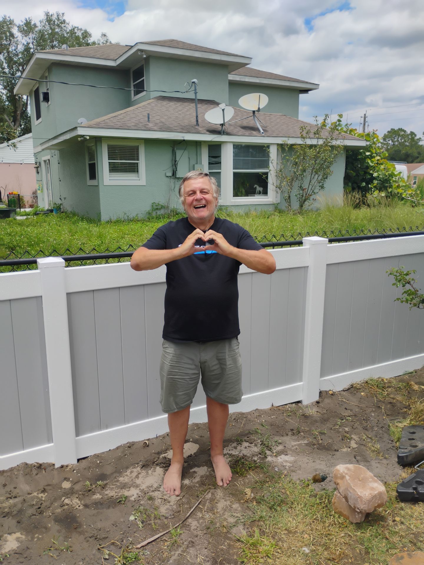 White and Gray Vinyl Privacy Fence Installation in North Port by True Fence LLC