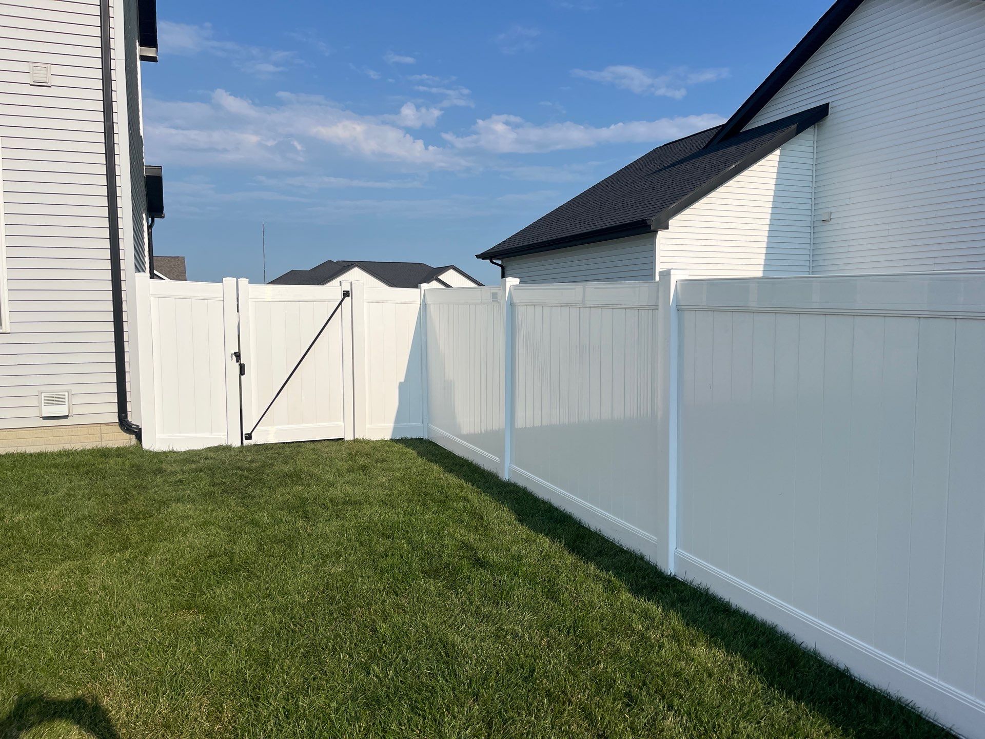 White Vinyl Privacy Fence Installation With Double Gates in Waterloo by Perfect Picket Fence and Stain