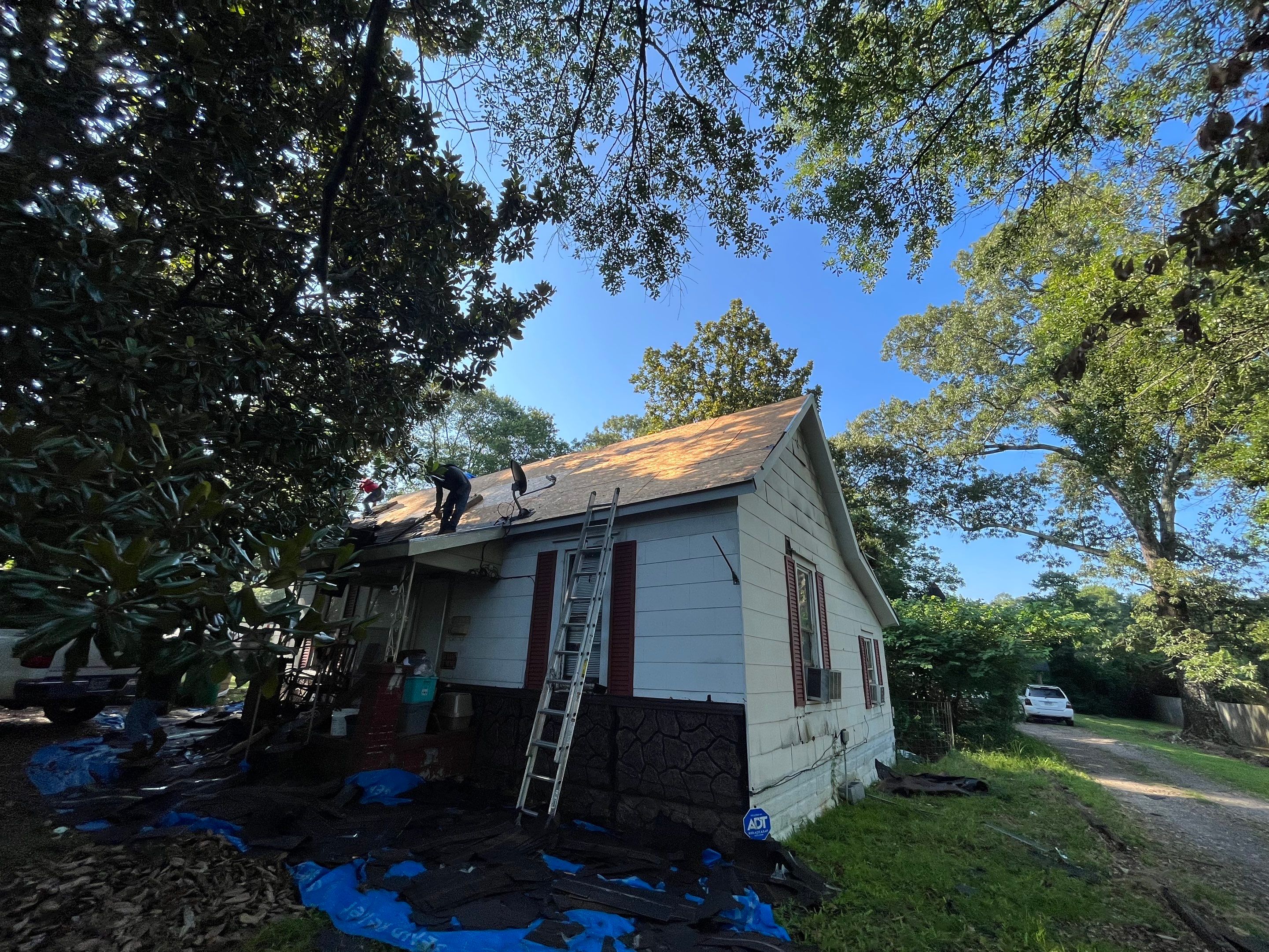 Storm Restoration Reroof: 25 Year 3-Tab Shingle by Hostetler Roofing