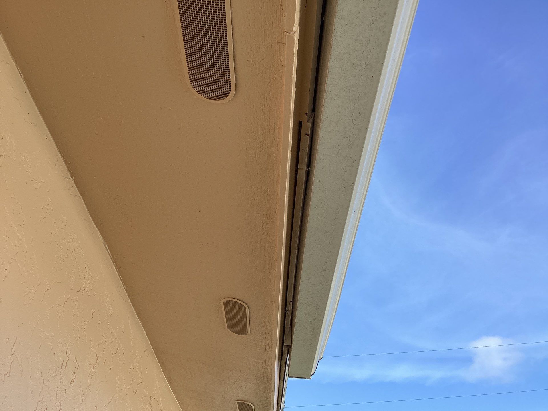 White K Style Seamless Gutters using 3X4 Elbow Downspout in Cape Coral FL by Gutter Professors