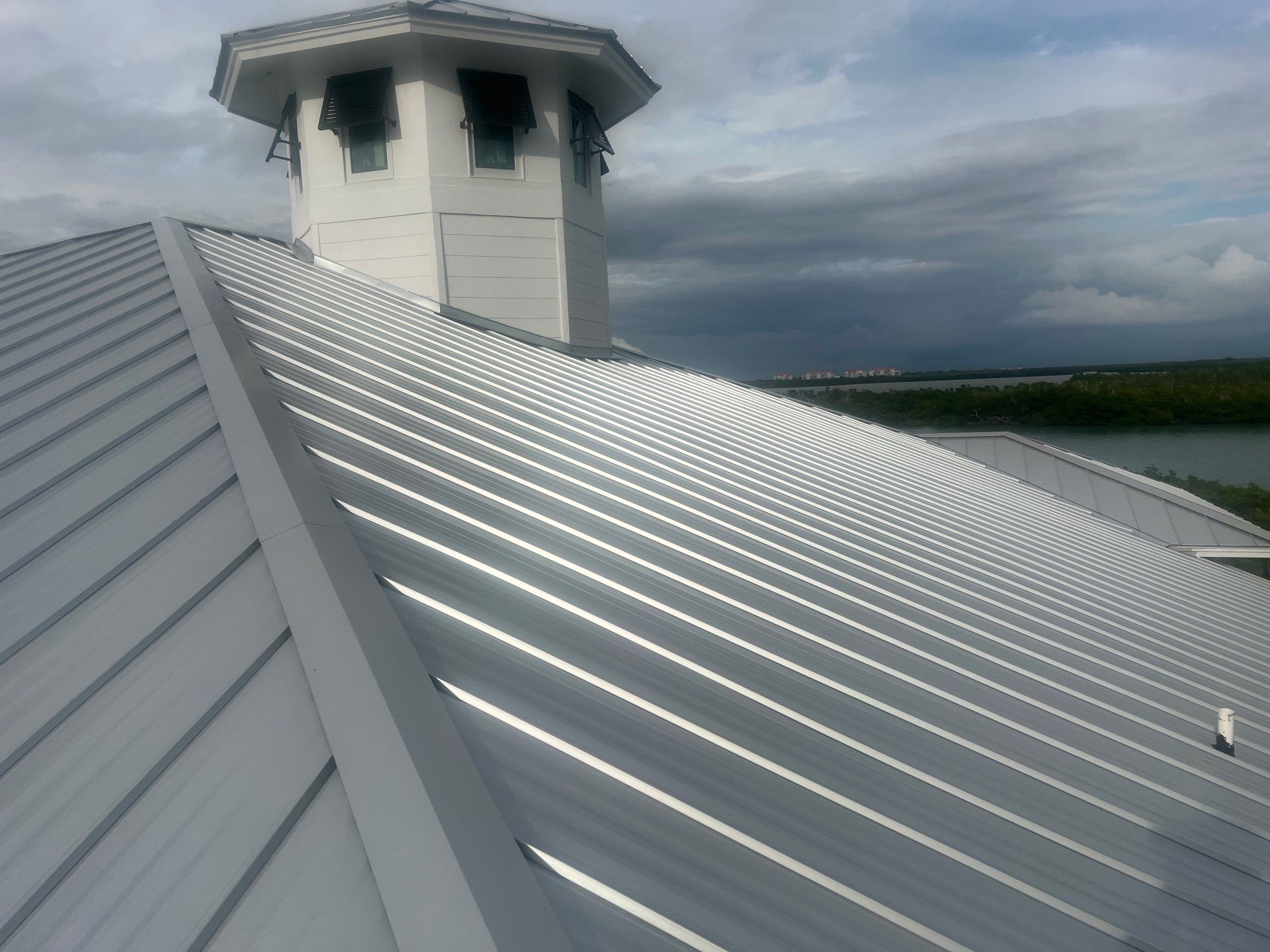 Residential Roofing Installation using Galvalume Standing Seam by Durabilis Roofing INC