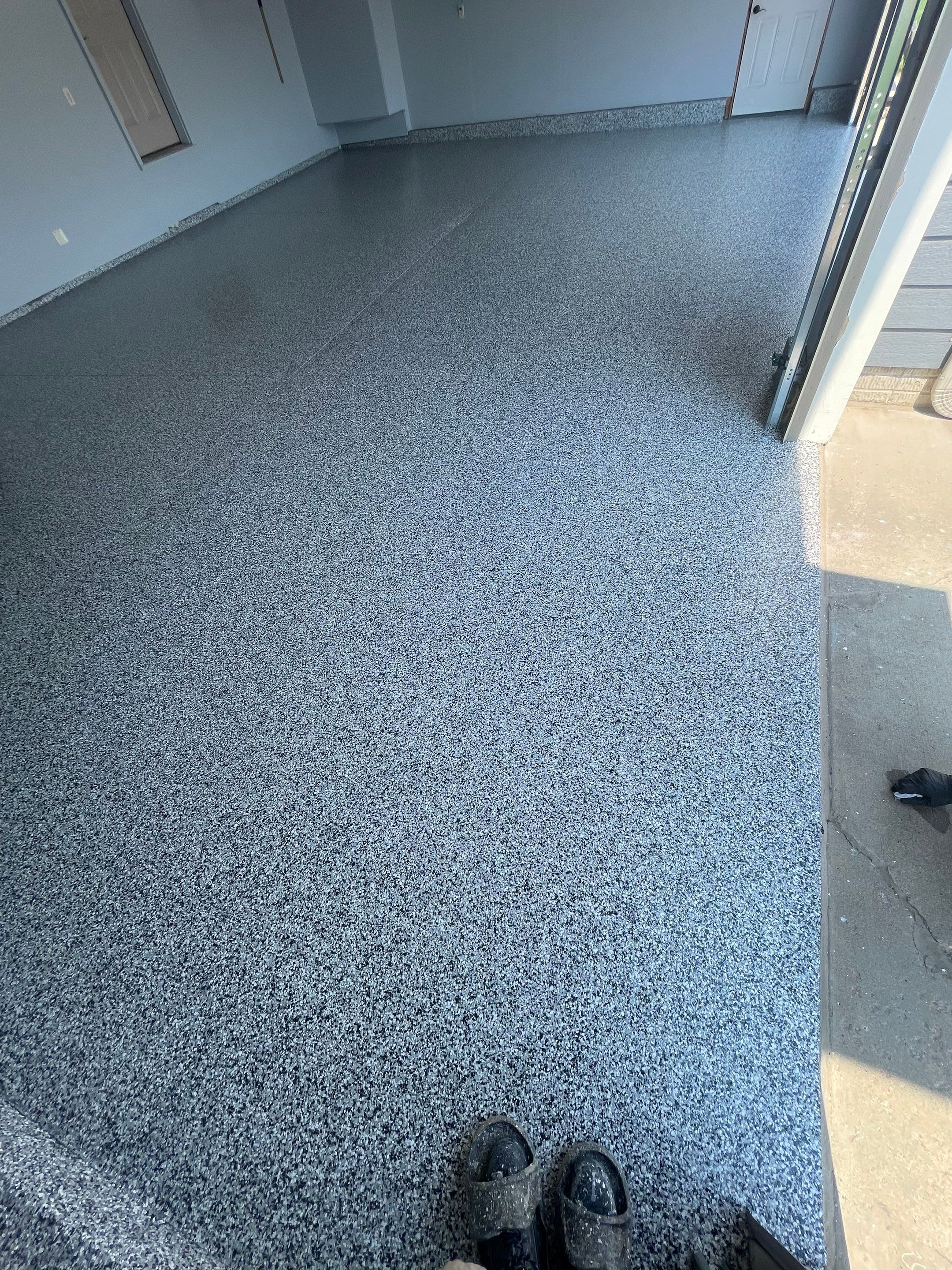 Sioux Falls Garage Concrete Coating Installation with Domino Flake by Select Painting, Coatings & Garage Cabinets