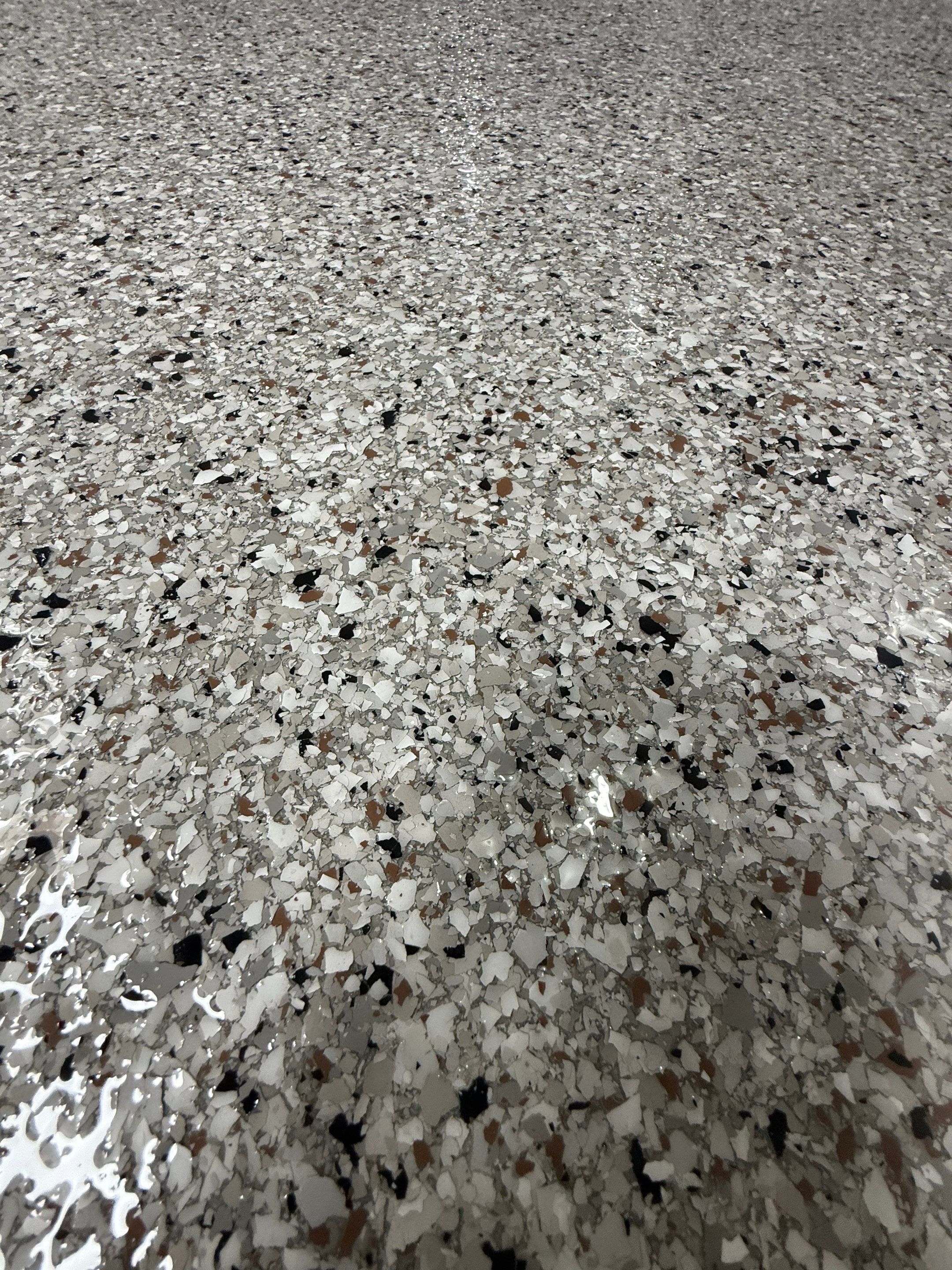 High-Gloss Epoxy Garage Floor Coating in Sioux Falls by Select Painting, Coatings & Garage Cabinets