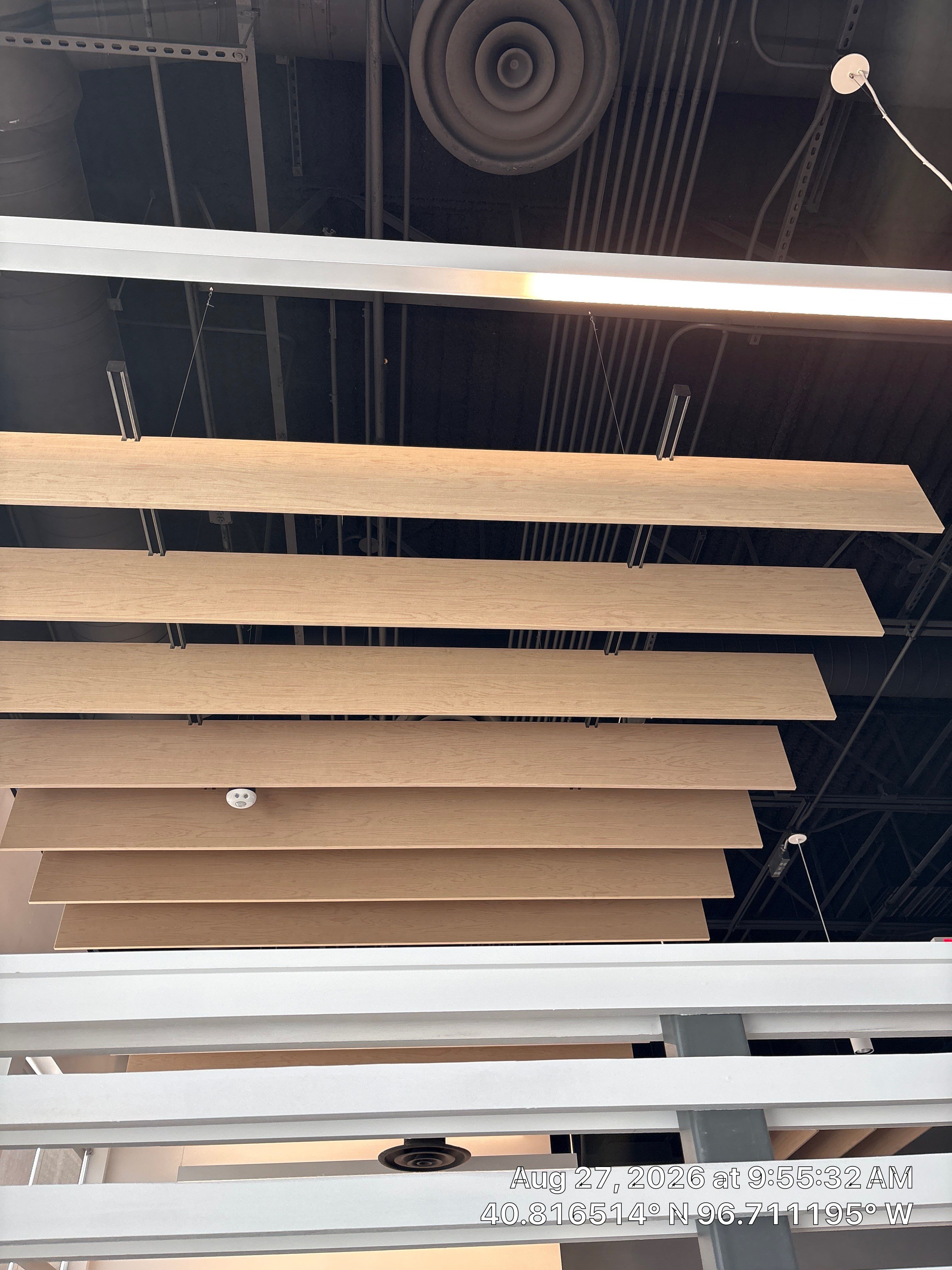 Modern Office Interior Renovation with Acoustic Wood Baffles in Lincoln by CompanyCam Sales Demo