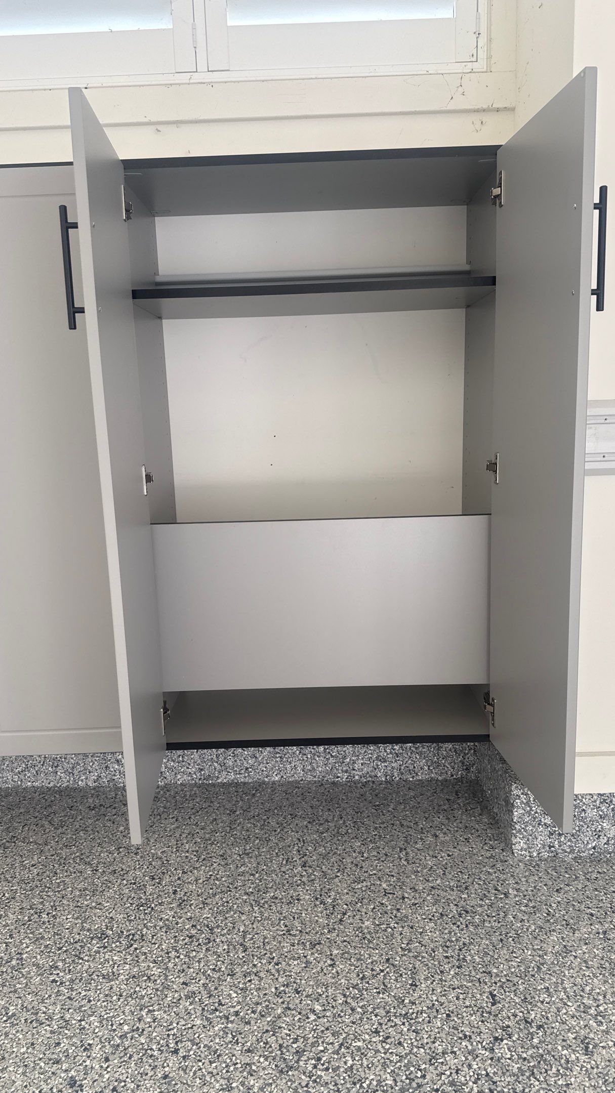 Nick's New Floor & Storage Looks Beautiful by Banner Garage