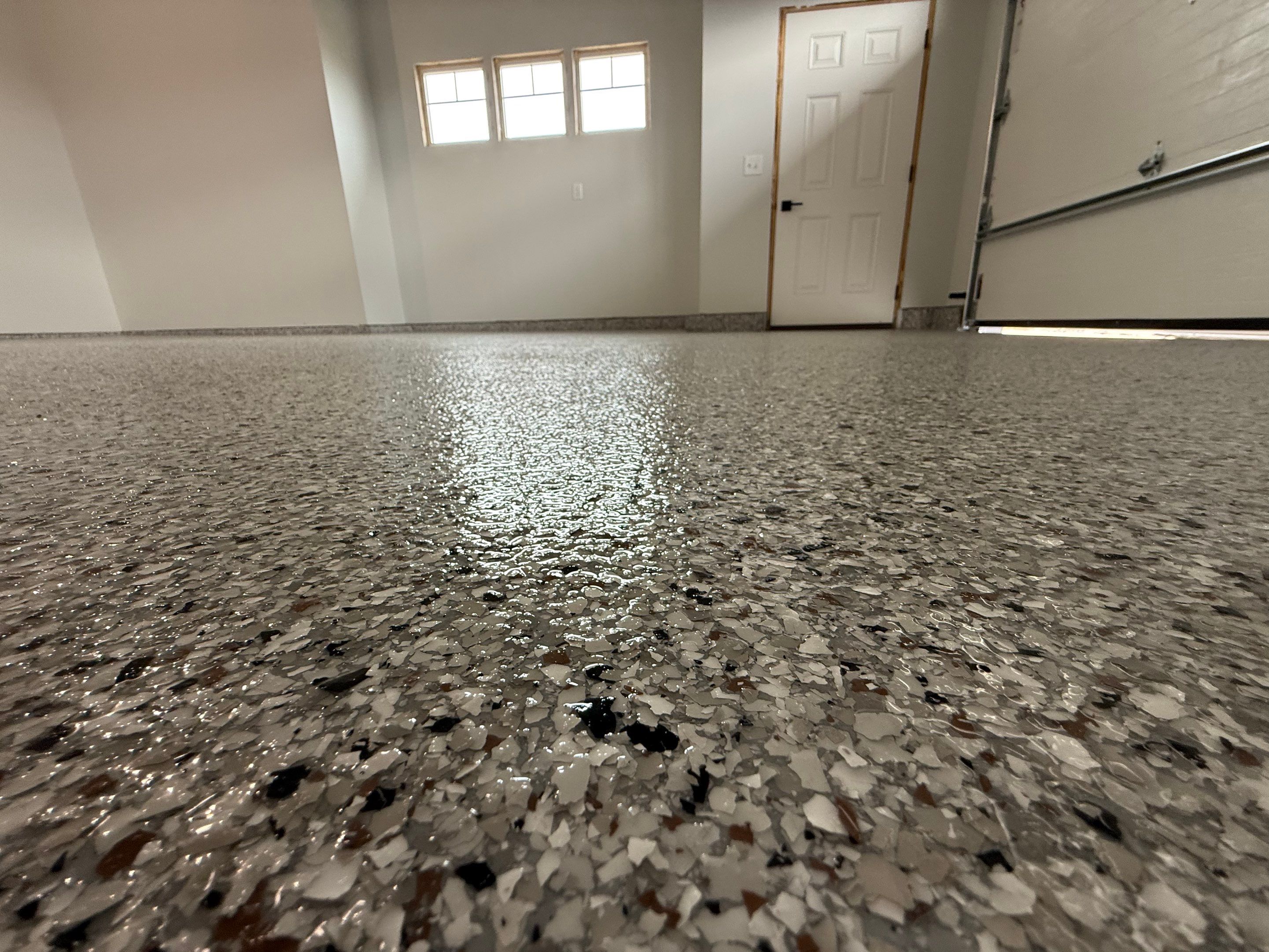 High-Gloss Epoxy Flake Garage Floor Coating in Brandon by Select Painting, Coatings & Garage Cabinets