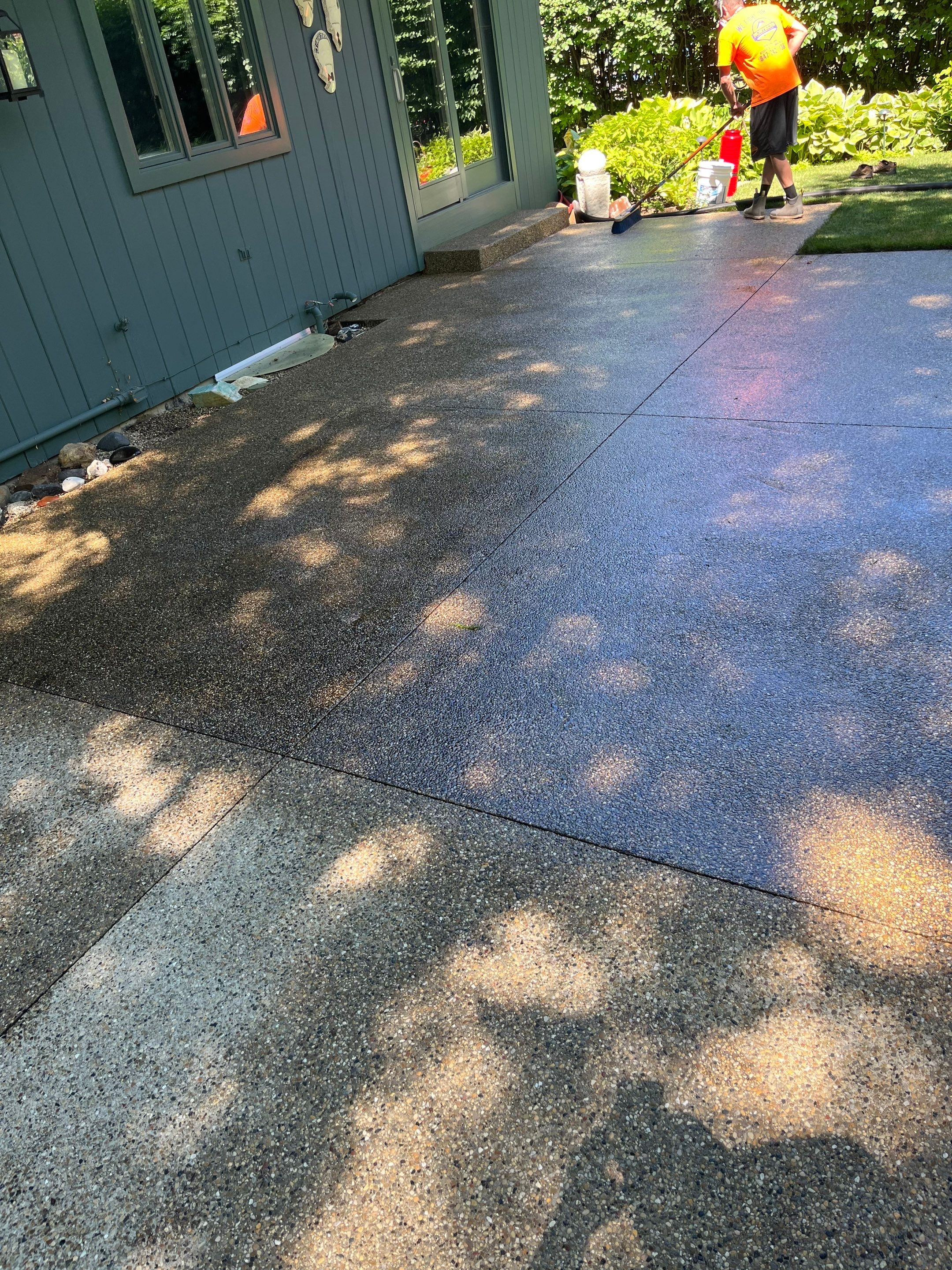 Aggregate concrete cleaning and sealing using Surebond SB-9000 by Northern Power Washing LLC.