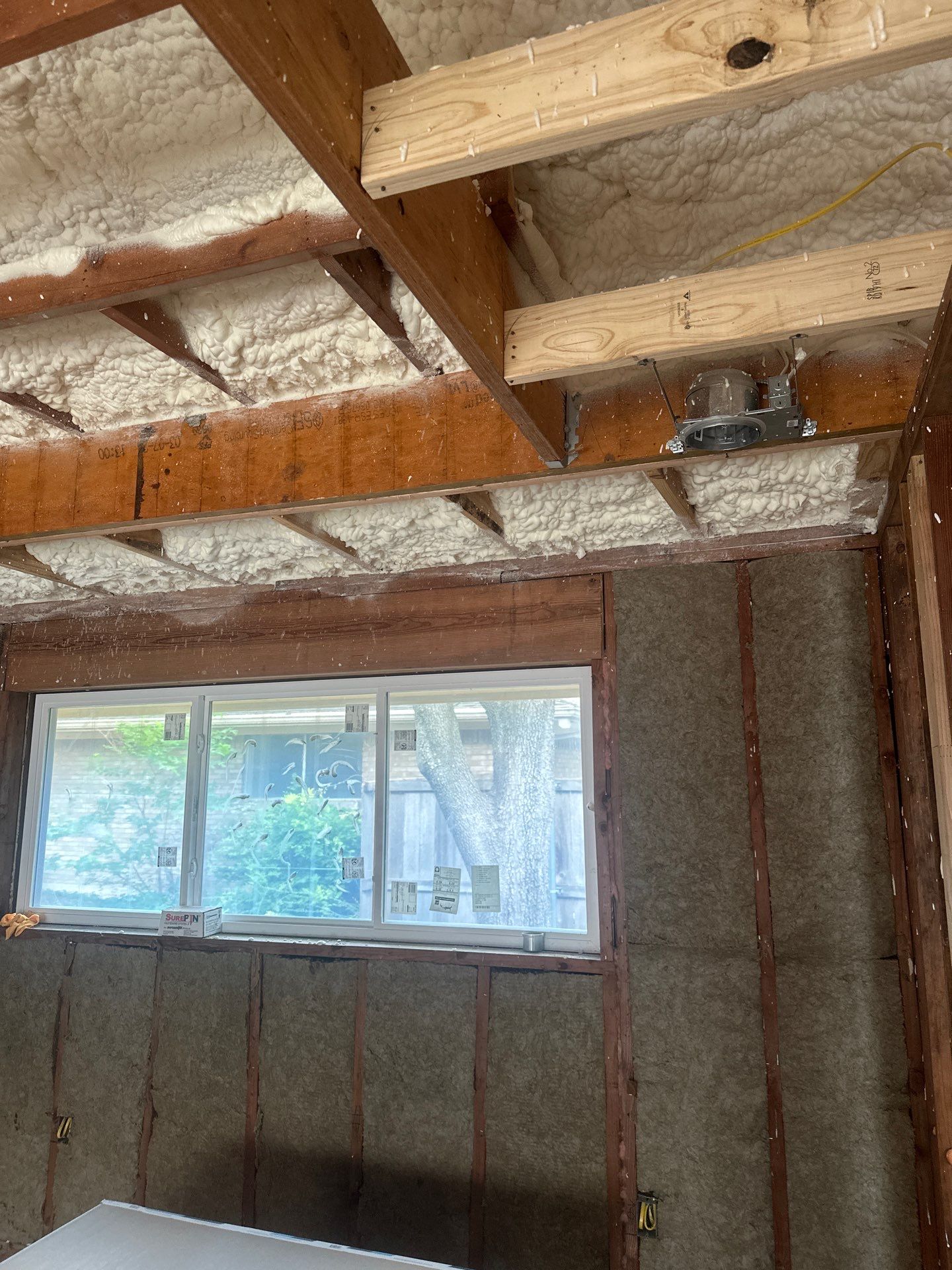 Open cell spray foam & rockwool job completed in Dallas TX by Apex Insulation Solutions