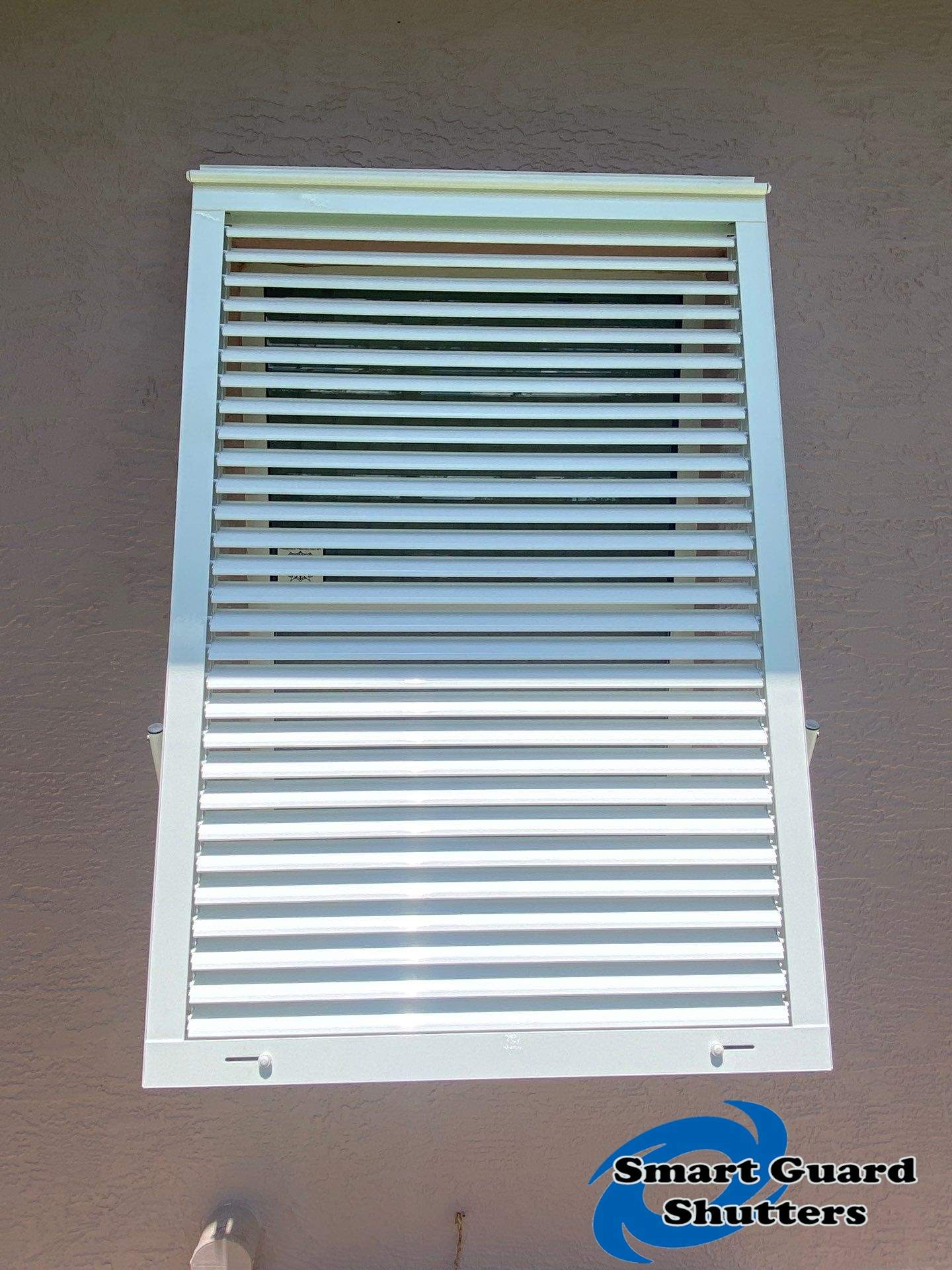 Impact Bahama Shutters in Signal White by Smart Guard Shutters